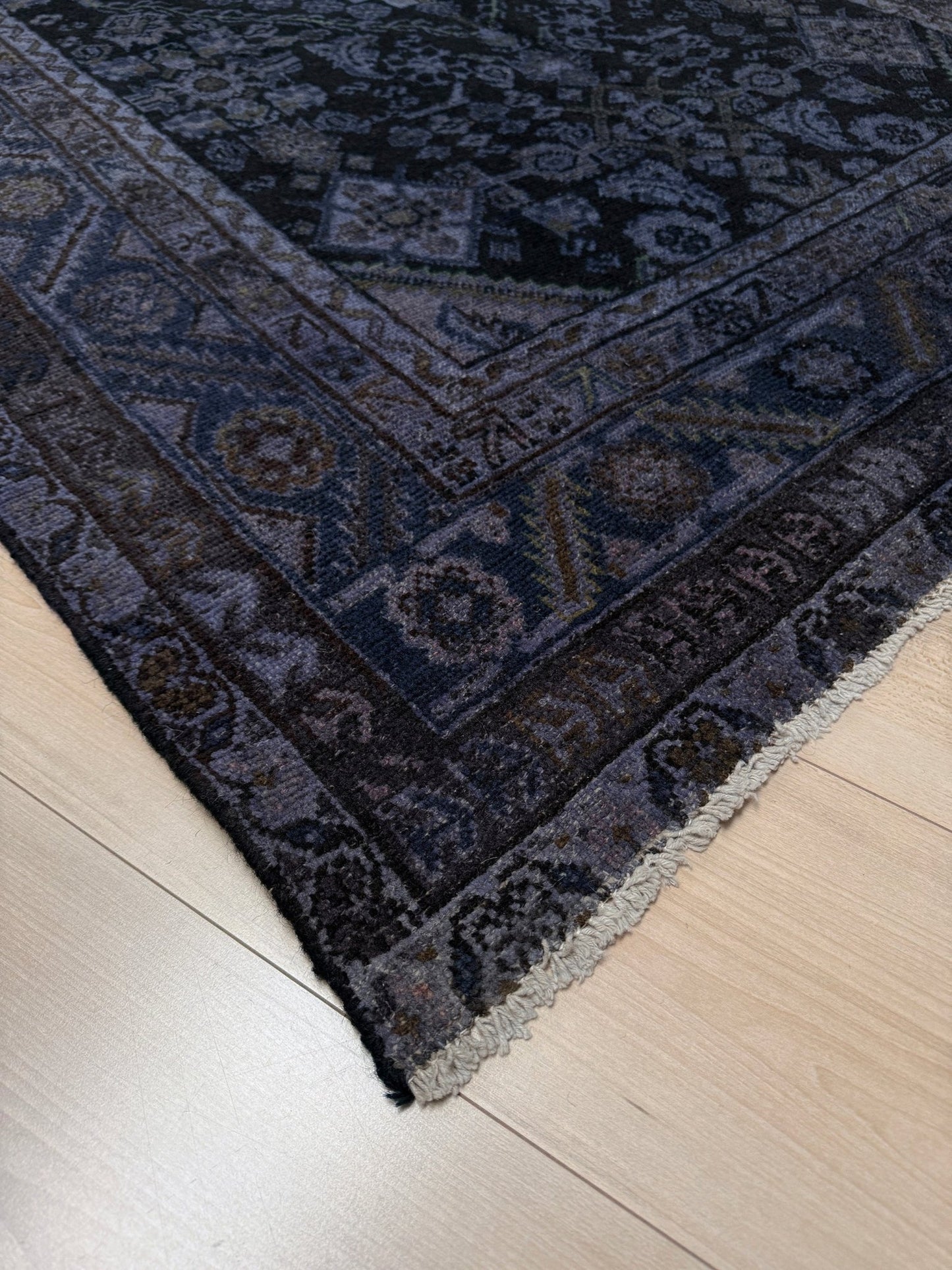 5x7 Distressed vintage Persian rug with deep indigo, charcoal, and muted lavender hues, featuring an intricate medallion and floral design. Perfect for bedroom, living room, or dining area, adding character and timeless elegance. Available at the best rug shop in San Mateo, SF Bay Area, with free shipping. Transitional and contemporary style with a beautifully worn, sophisticated look.