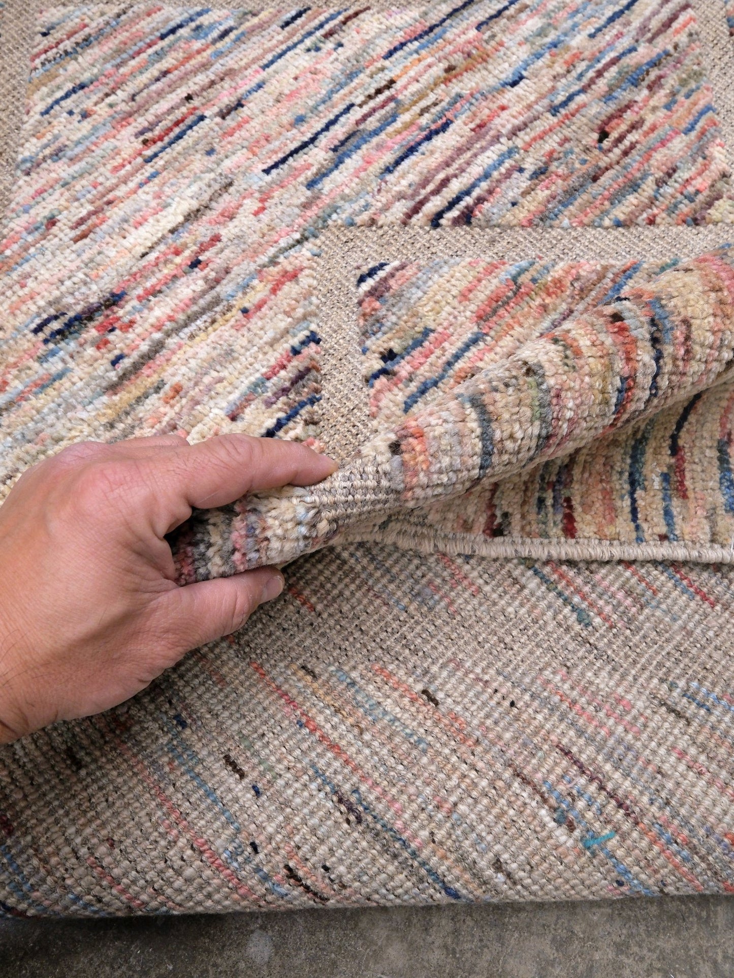 Painterly pastel 6x9 Turkish Tulu rug with raised geometric triangle pattern in ivory, oatmeal beige, blush pink, taupe, handmade textured wool from Indigo Rugs Burlingame Bay Area.