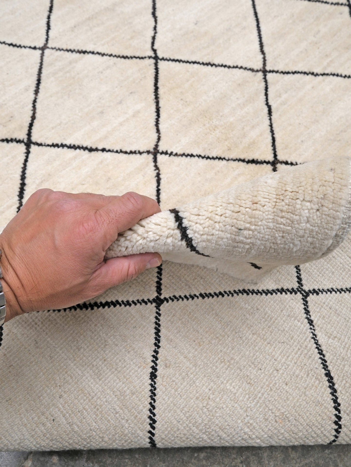 Ivory natural beige minimalist Moroccan handmade wool rug with black diamond pattern, soft cream field and organic modern geometric design, 6x8 from Indigo Rugs Burlingame Bay Area.