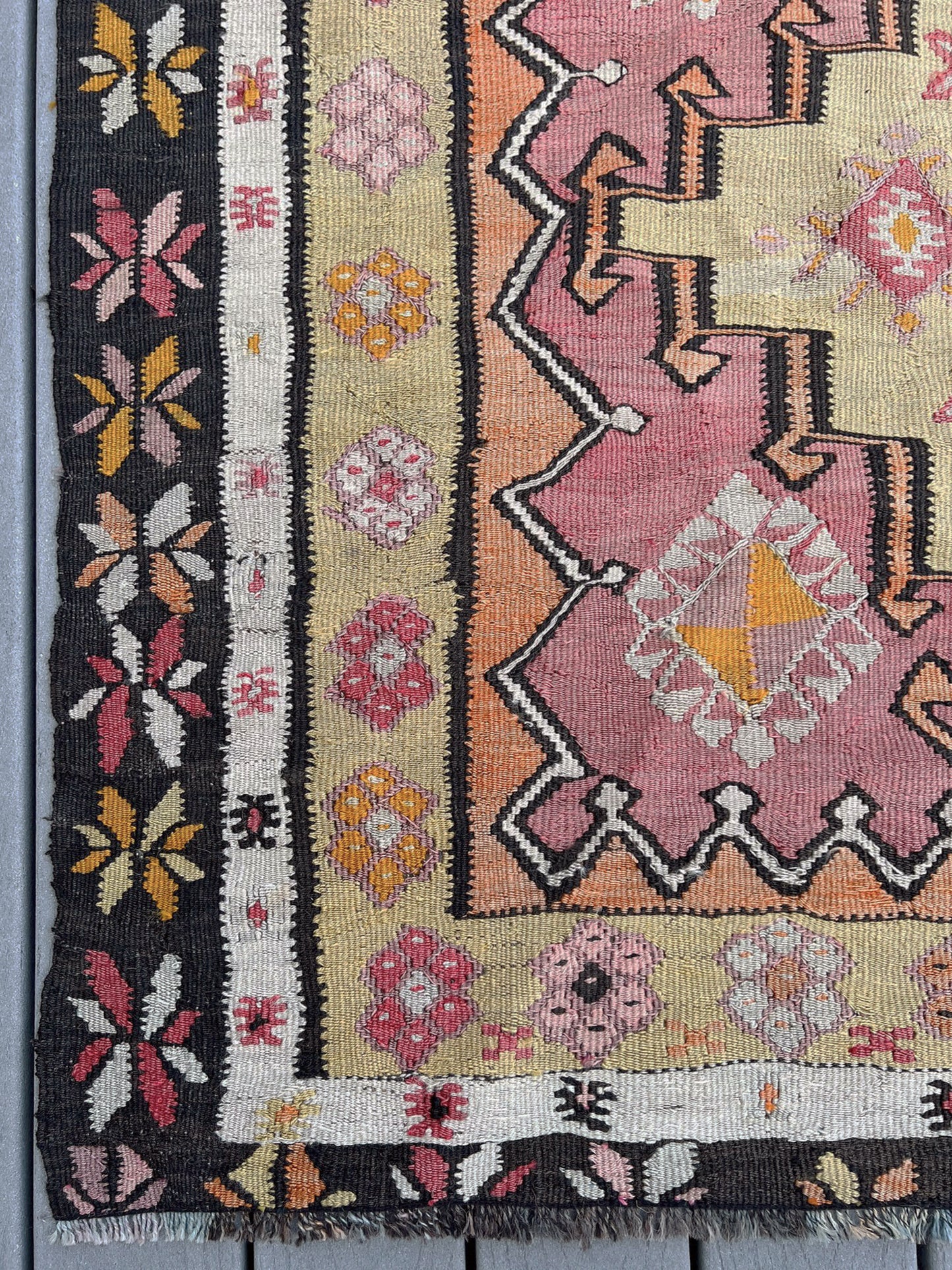 Vintage Kurdish runner rug from Eastern Turkey, 4x10, with dusty rose and peach medallions, floral borders, and woven inscription dated 1948.