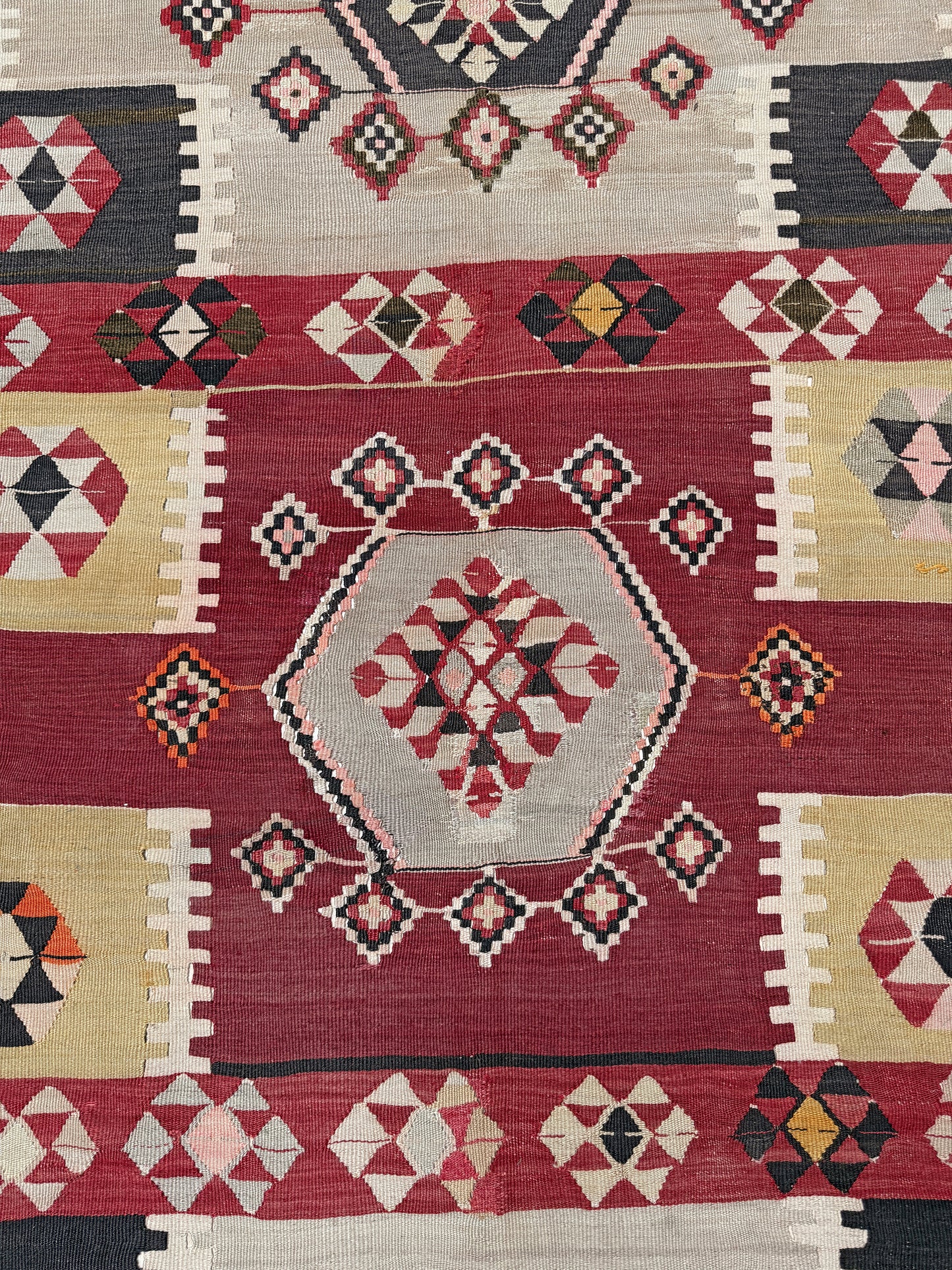 Vintage Milas Turkish kilim geometric rug in madder red, charcoal black, handmade wool flatweave area rug 6x10 with authentic Anatolian tribal character