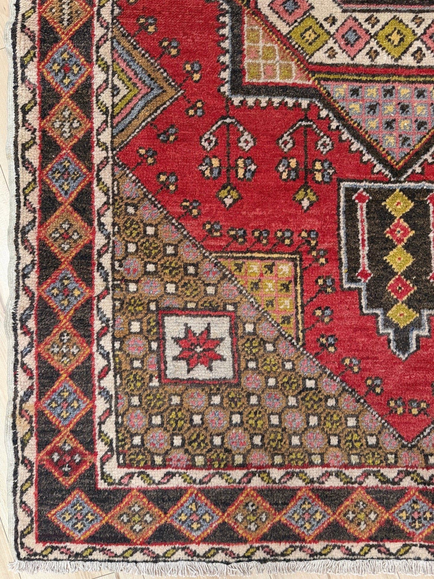 5x7 Vintage Turkish rug in rich crimson red with intricate medallion design, floral and geometric motifs—perfect for bedroom, living room, or dining space. High-quality wool rug with vibrant hues of mustard yellow, olive green, and pale pink. Available at the best rug shop in San Mateo, SF Bay Area, with free shipping. Timeless character and craftsmanship for a stylish, cozy home.