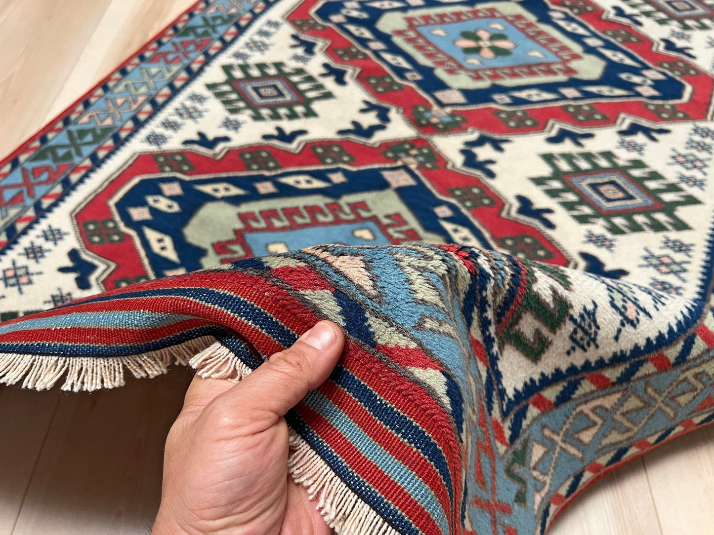 Baby Blue White Tribal Turkish Rug, handmade wool carpet, 4x6 traditional rug for living room, bedroom, kitchen, entryway, nursery, available at Indigo Rugs, San Francisco Bay Area’s best place to buy a rug, featuring intricate tribal motifs and soft wool texture.