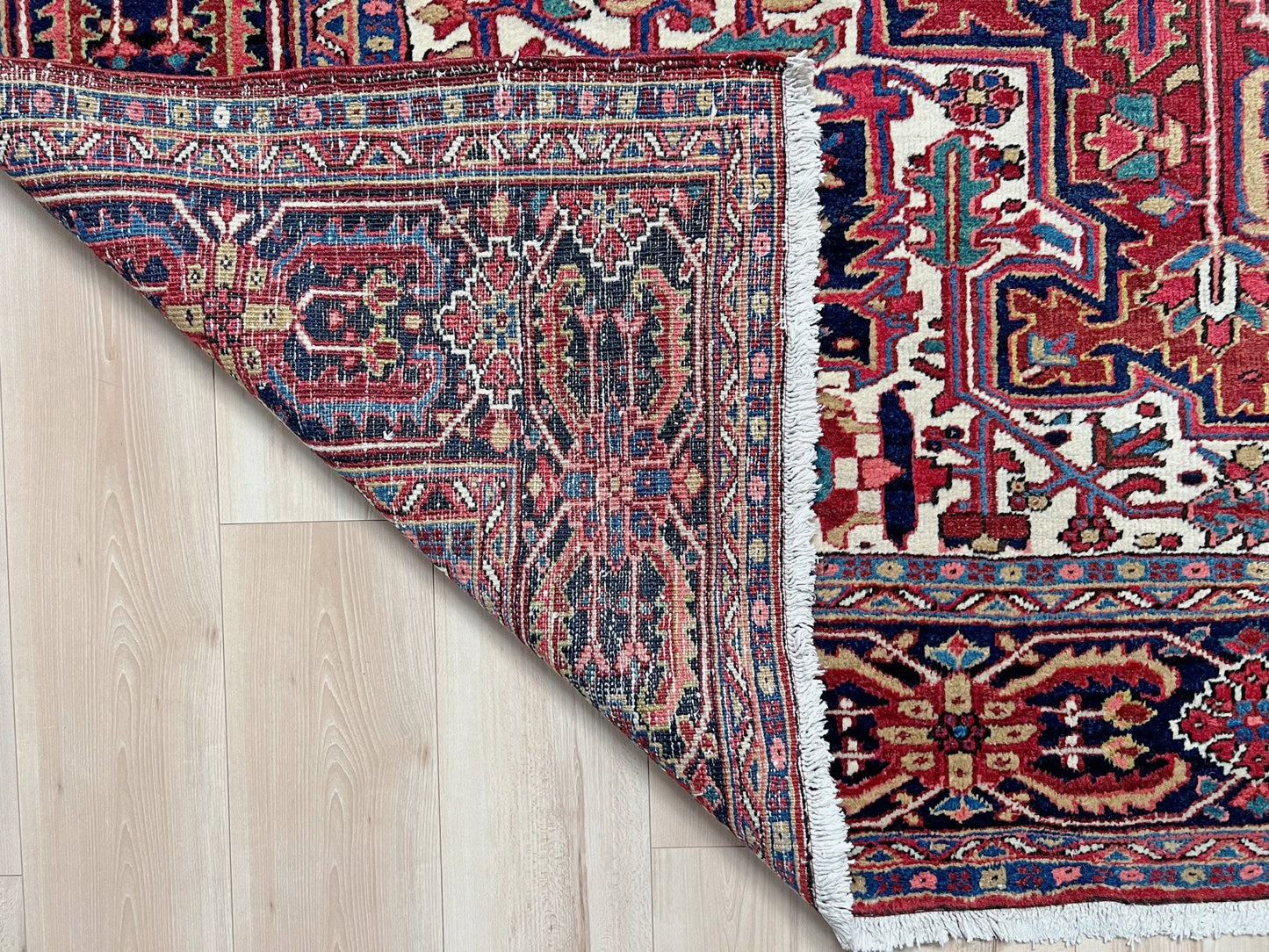 10x14 oversize handmade Persian Heriz vintage rug madder red and navy — shown in living room at Indigo Rugs, Burlingame — San Francisco Bay Area with free shipping