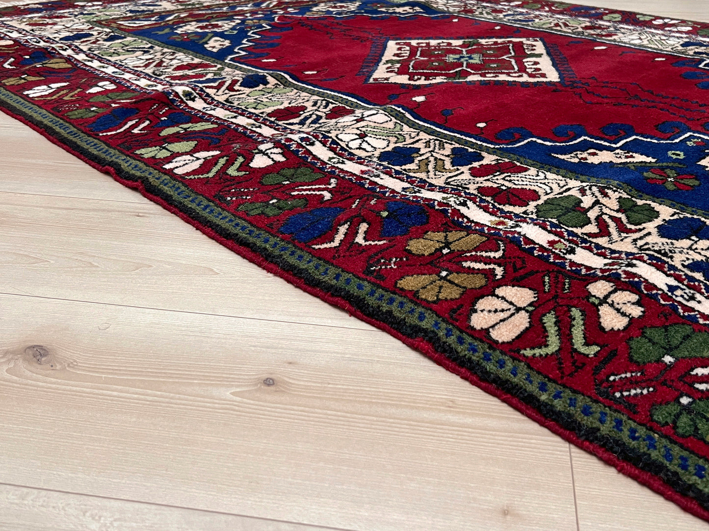 crimson red vibrant anatolian turkish vintage rug 5x7 traditional handmade village wool rug blue medallion floral border plush pile indigo rugs san francisco bay area