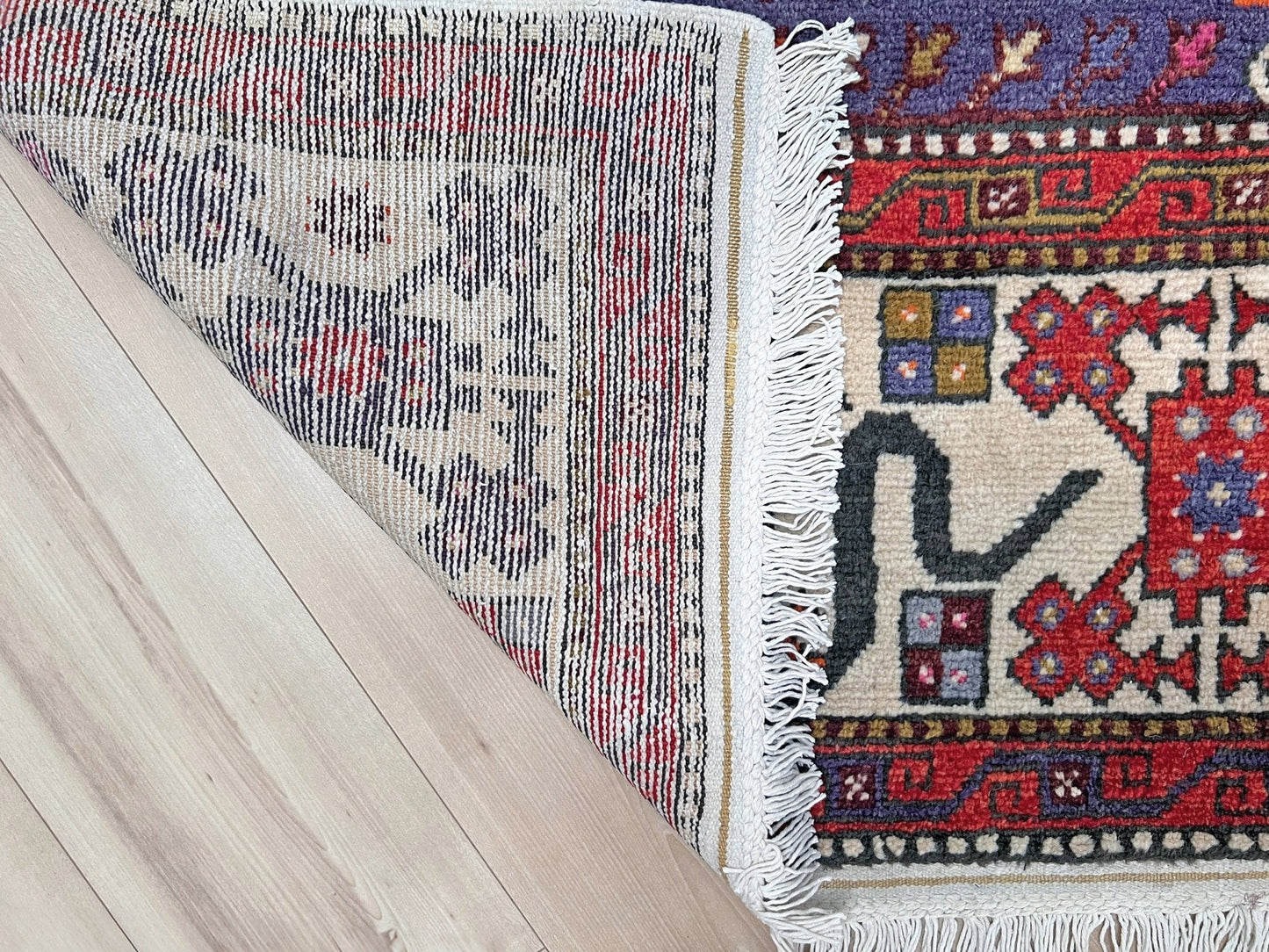 Vintage Turkish Cloudband rug with a golden olive center and bold geometric medallion, surrounded by plum, burgundy, periwinkle, and ivory tribal motifs. Handmade Colorful Vibrant Anatolian wool rug, 6x9 , perfect for living rooms or bedrooms. From Indigo Rugs, Burlingame — San Francisco Bay Area.