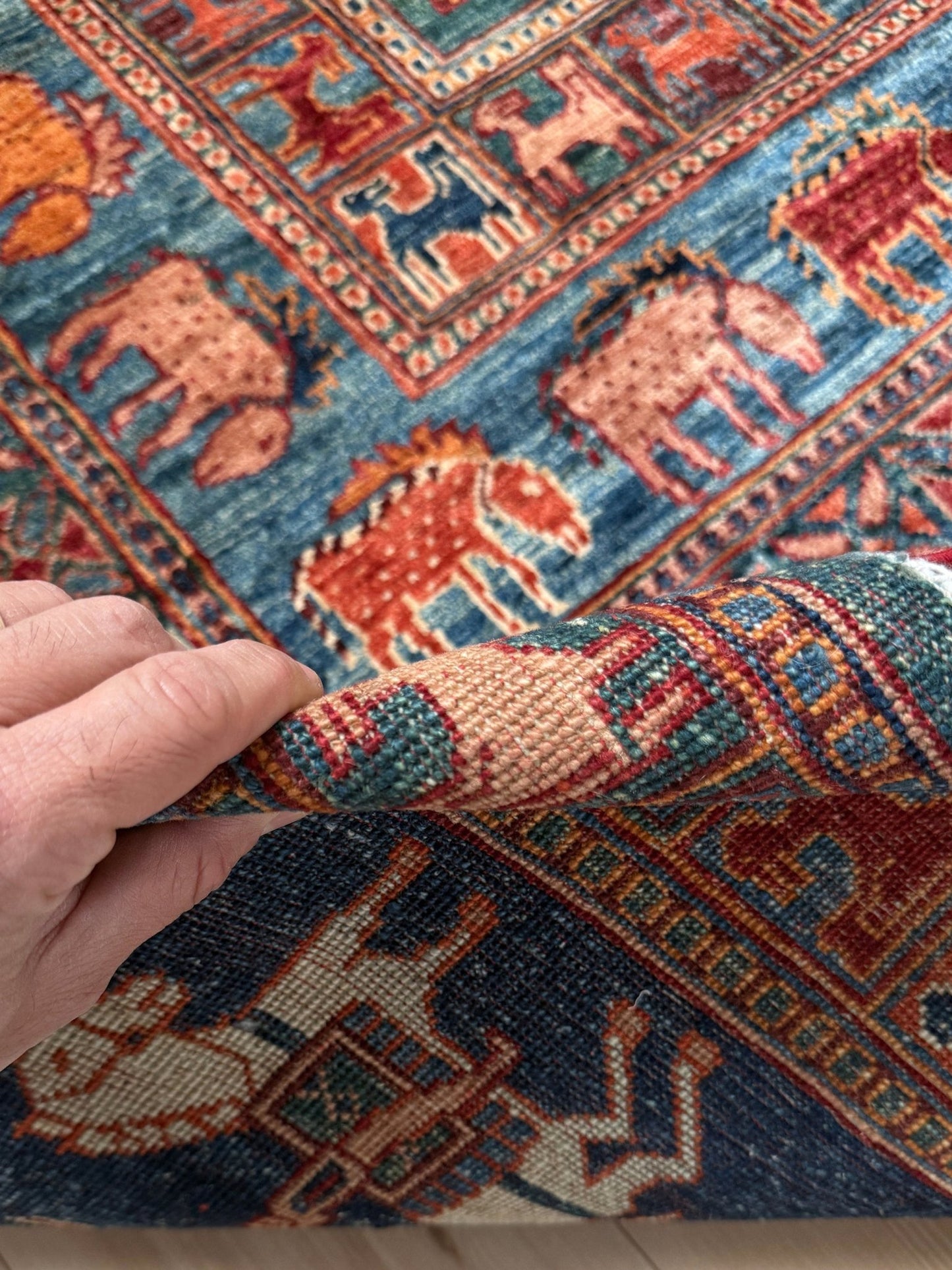 9x12 Pazyryk Turkish rug with intricate animal and geometric designs in indigo, terracotta, and ivory tones – perfect for bedroom, living room, dining room, or office – available from the best rug shop in San Mateo, SF Bay Area with free shipping.