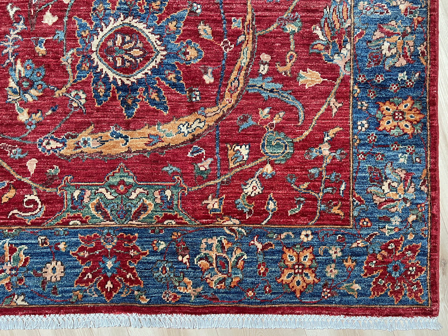 8x10 Sickle Leaf Luxury Area Rug • Handmade Wool Carpet large Rug for Living Room, Bedroom, Dining & Office
This exquisite oriental rug features the traditional Persian sickle leaf design elegantly woven on a rich red ground. The intricate blue borders add a touch of sophistication, enhancing the rug's timeless appeal. Crafted from the finest silky wool, this rug offers both luxurious softness and exceptional durability.