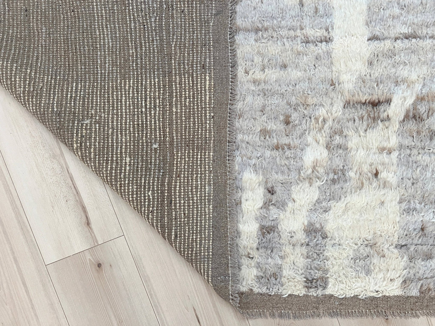 9x12 Minimalist Handmade Shag Moroccan Wool Area Rug with Neutral color Shop San Francisco Rug Bay Area. Buy Handmade Area Carpet Palo Alto Berkeley San Francisco Bay Area. Fee shipping