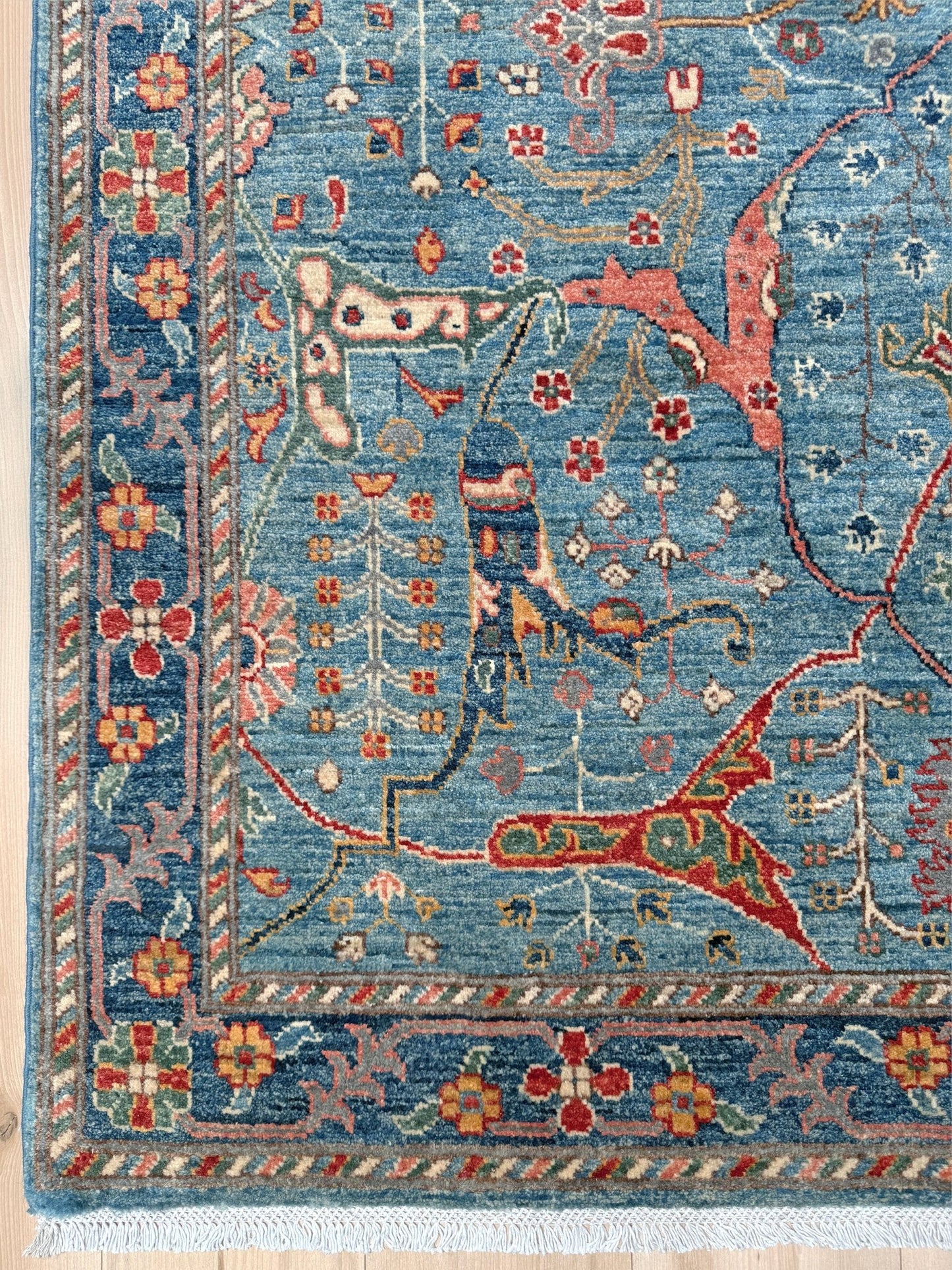 Handmade Garrus Bijar design rug in sky blue with floral and animal motifs, almost 5x7 size—perfect for living room, bedroom, kitchen, or dining area. Complements traditional, eclectic, bohemian, and transitional home decor styles. From the best rug shop in San Mateo, SF Bay Area with free shipping. Rich in rust red, ivory, and gold tones for a warm, timeless look.