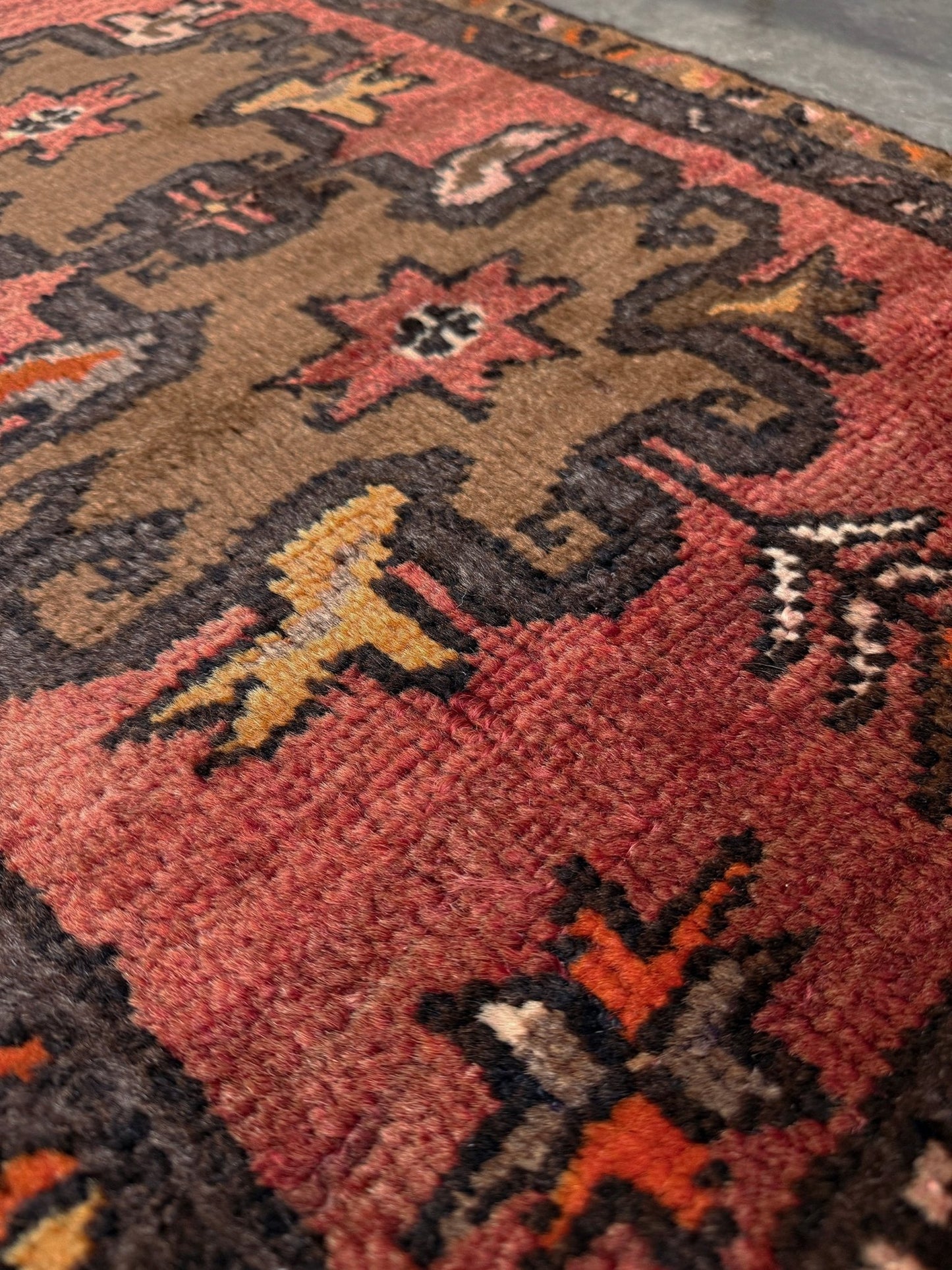 Vintage Turkish Yastik rug with a terracotta field, olive-brown medallions. Hand-knotted wool, 24x34 inches. Perfect accent mini rug kitchen, entry, bathroom, study. One-of-a-kind rug from Indigo Rugs in Burlingame, the best rug shop in the San Francisco Bay Area. Free shipping included.