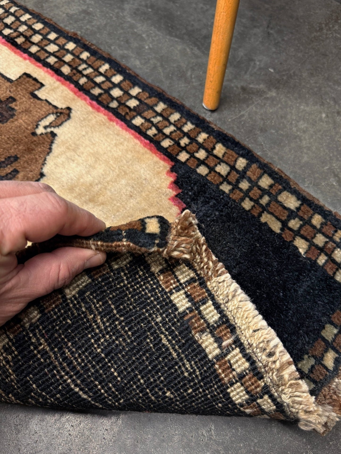 Neurtal Vintage Turkish mini rug 2x3, perfect for entryways, bedside, or layered décor. with a soft ivory field and bold geometric medallion in warm brown tones, framed by a deep cocoa-brown border with subtle brick-red accents. Handmade Anatolian wool rug, From Indigo Rugs, Burlingame, San Francisco Bay Area.