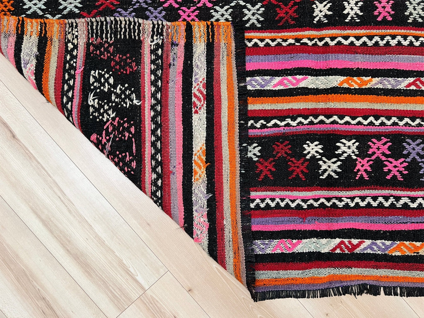 Pink striped Turkish kilim rug shop berkeley. Handmade rug San Francisco bay area. Vibrant color handmade wool rug.