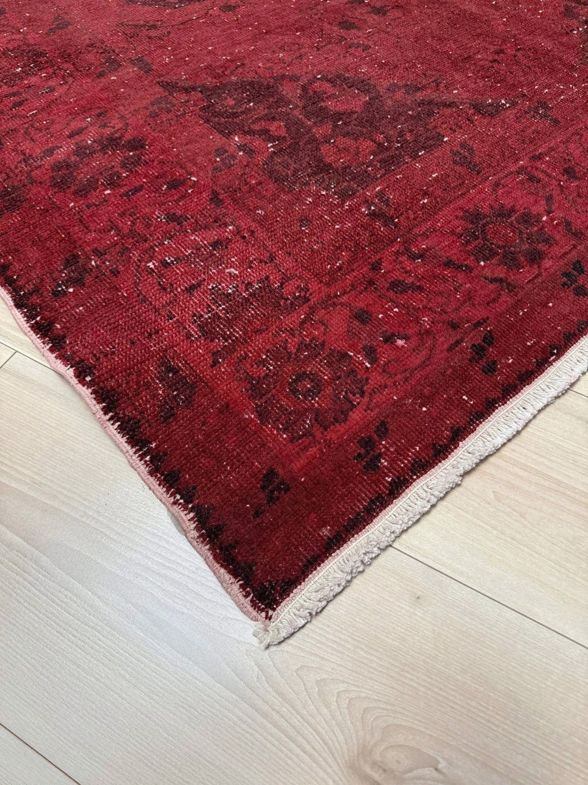 Moody red overdyed Turkish rug with distressed vintage pattern, deep burgundy red field, tonal medallion and border design, handmade wool accent rug 5x7 from Indigo Rugs Burlingame Bay Area