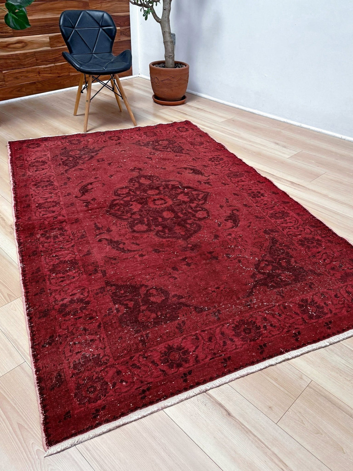 Moody red overdyed Turkish rug with distressed vintage pattern, deep burgundy red field, tonal medallion and border design, handmade wool accent rug 5x7 from Indigo Rugs Burlingame Bay Area