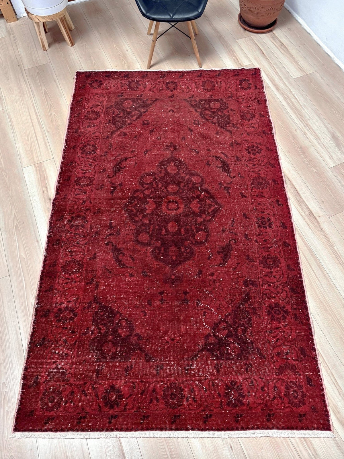 Moody red overdyed Turkish rug with distressed vintage pattern, deep burgundy red field, tonal medallion and border design, handmade wool accent rug 5x7 from Indigo Rugs Burlingame Bay Area