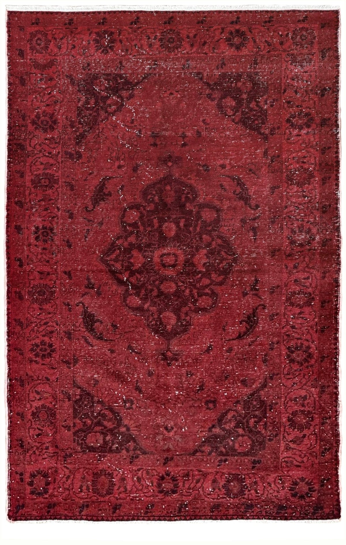 A square red oriental rug with a distressed, vintage-style pattern featuring a central medallion and dark brown corner accents. Moody red overdyed Turkish rug with distressed vintage pattern, deep burgundy red field, tonal medallion and border design, handmade wool accent rug 5x7 from Indigo Rugs Burlingame Bay Area