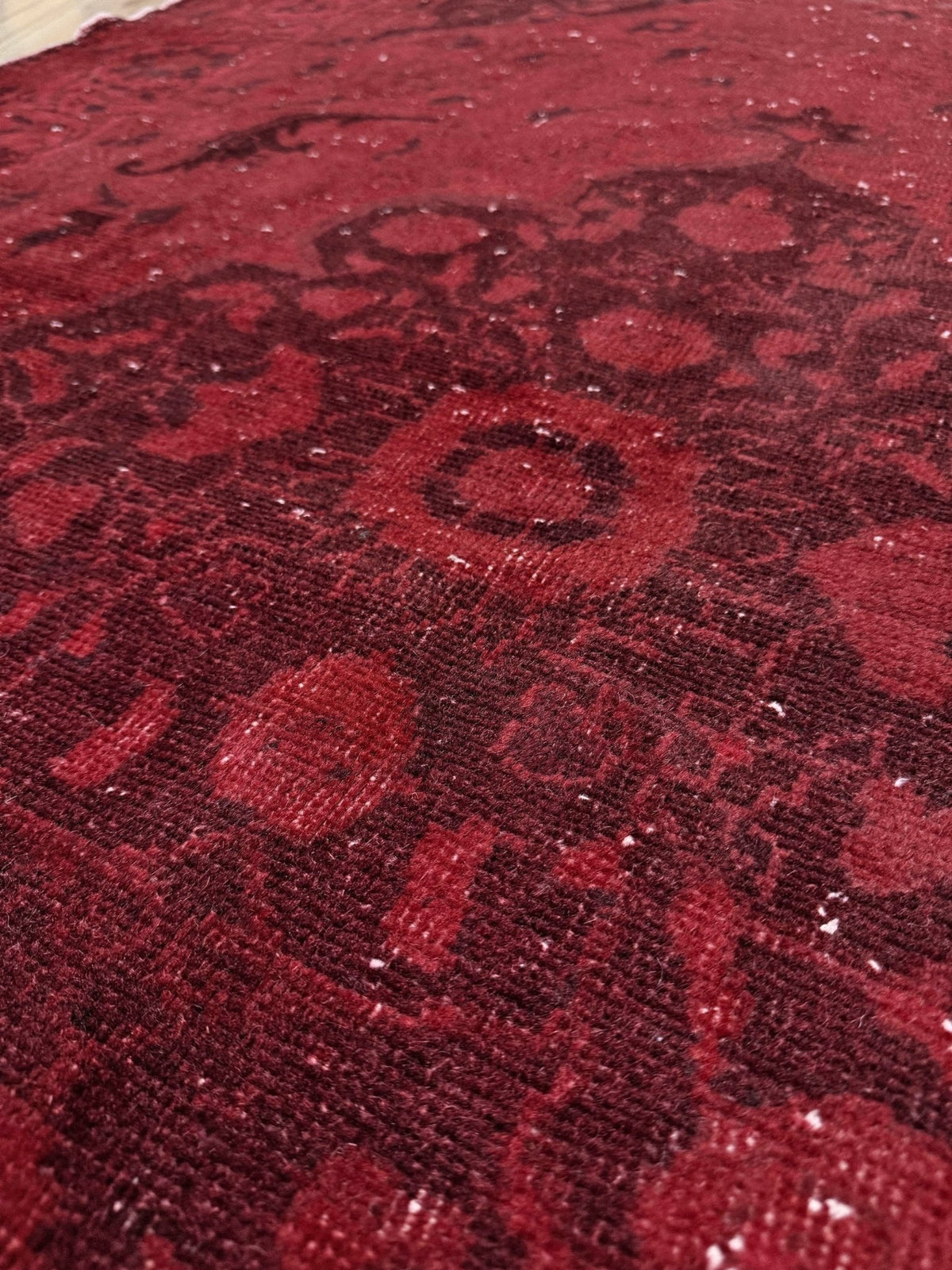 Moody red overdyed Turkish rug with distressed vintage pattern, deep burgundy red field, tonal medallion and border design, handmade wool accent rug 5x7 from Indigo Rugs Burlingame Bay Area