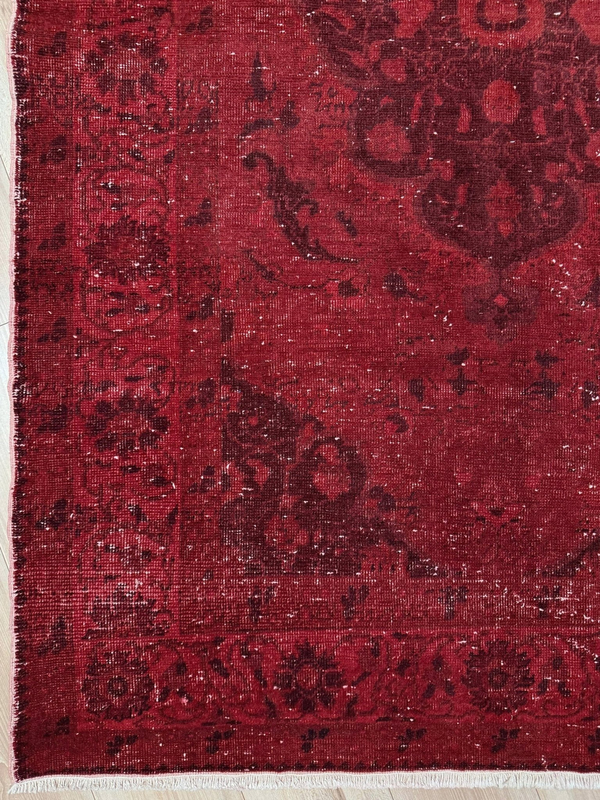 Moody red overdyed Turkish rug with distressed vintage pattern, deep burgundy red field, tonal medallion and border design, handmade wool accent rug 5x7 from Indigo Rugs Burlingame Bay Area