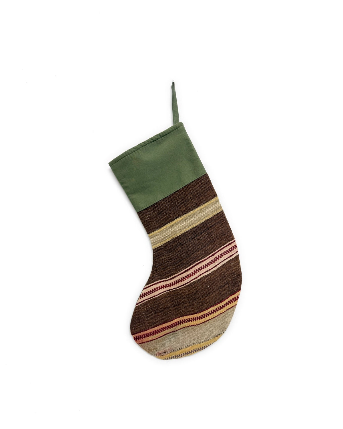A handwoven Kilim Christmas stocking with a solid olive green cuff and a striped body featuring brown, beige, and red woven patterns, shown against a plain white background.
