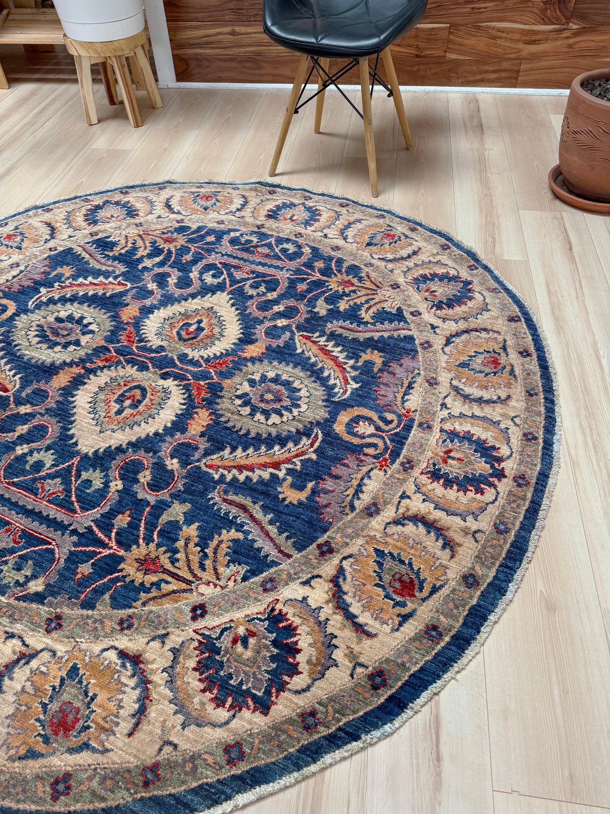 Round Oushak rug with blue field, beige border, muted gold, dusty red floral details, handmade wool 6x6 round area rug from Indigo Rugs Burlingame Bay Area.