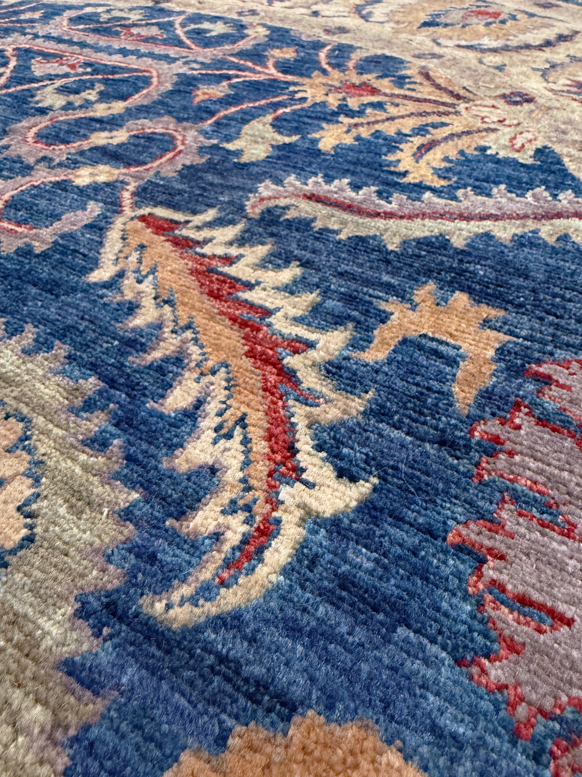 Round Oushak rug with blue field, beige border, muted gold, dusty red floral details, handmade wool 6x6 round area rug from Indigo Rugs Burlingame Bay Area.