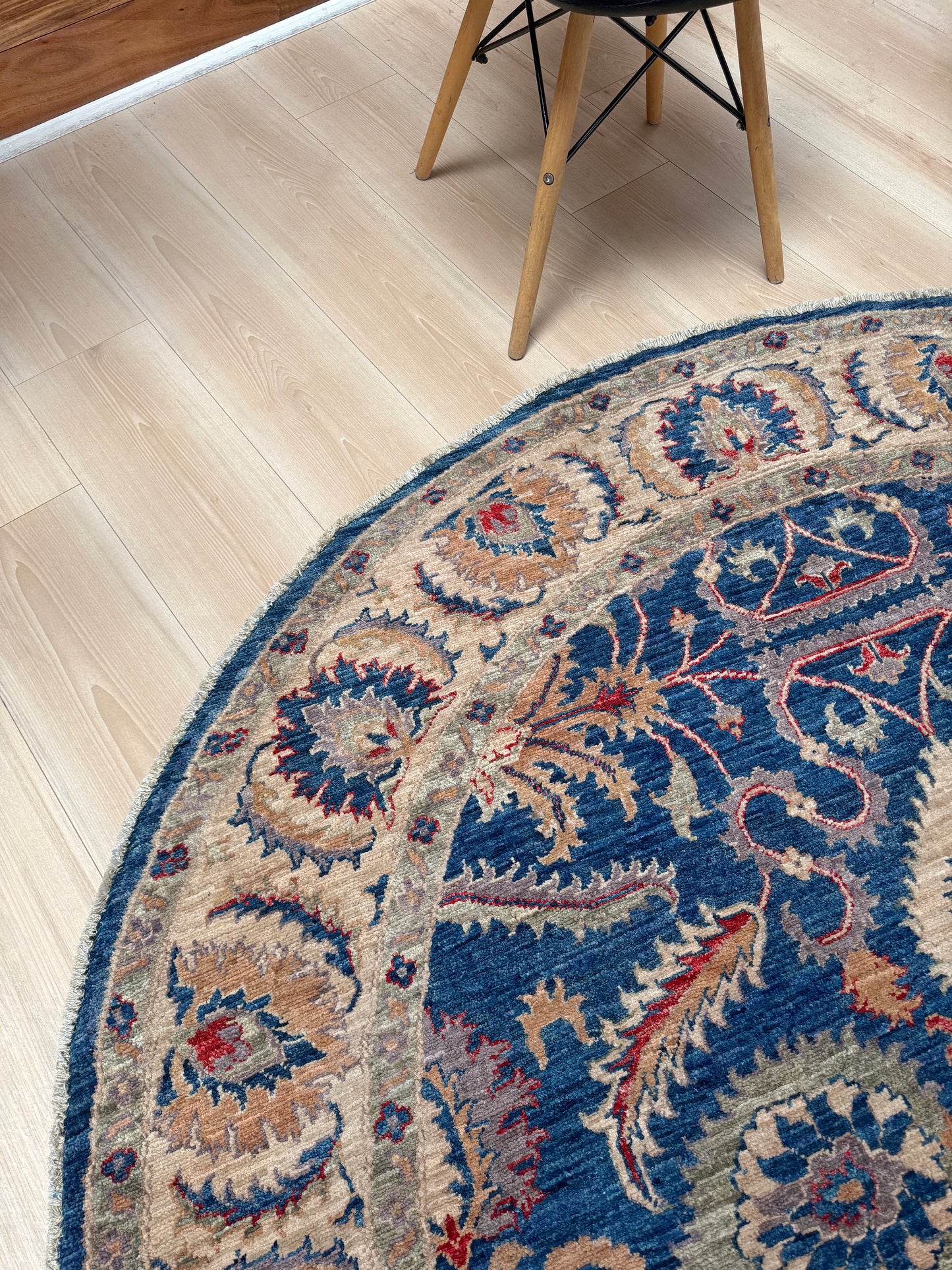Round Oushak rug with blue field, beige border, muted gold, dusty red floral details, handmade wool 6x6 round area rug from Indigo Rugs Burlingame Bay Area.