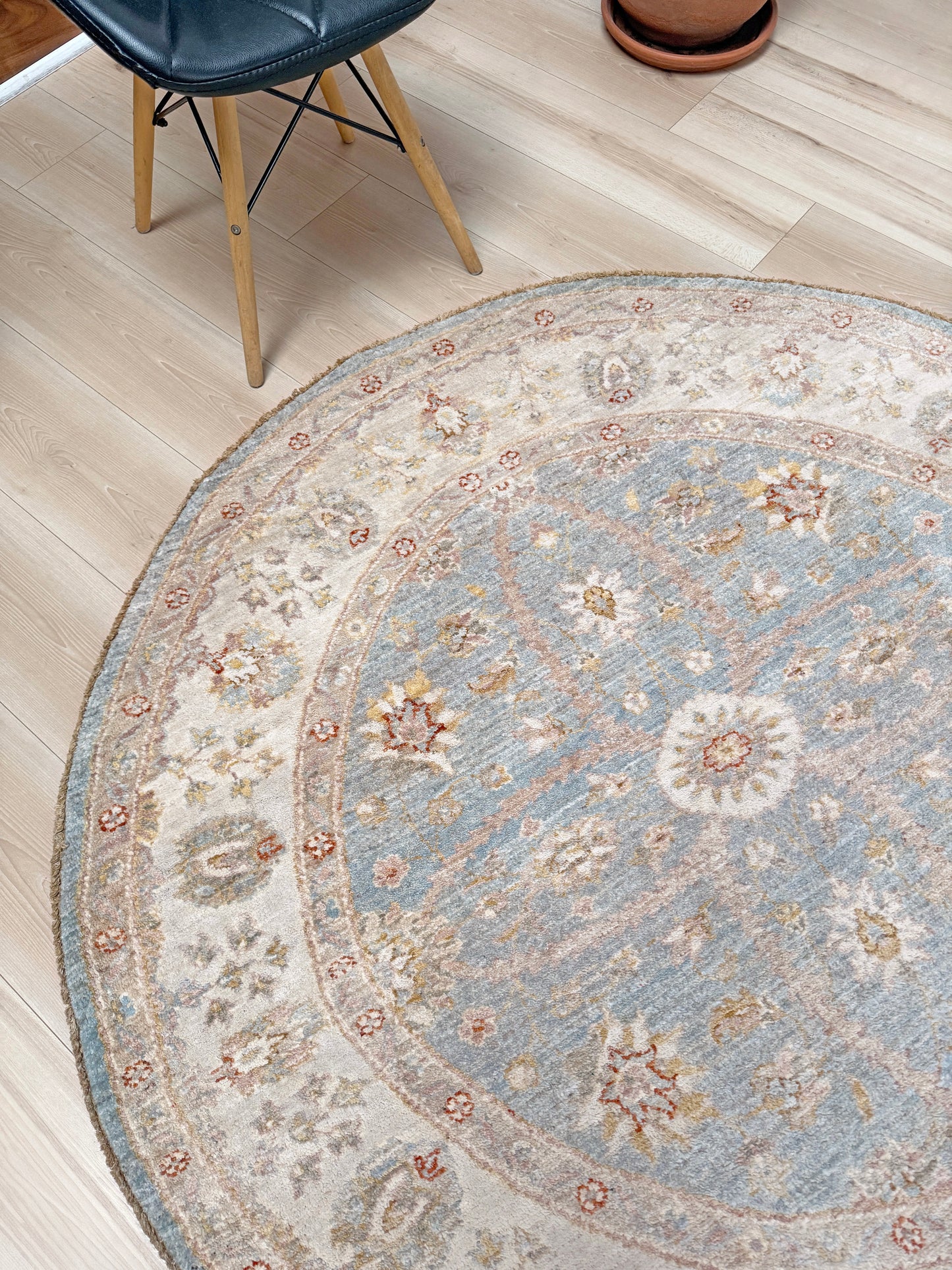 Pale blue round Turkish Oushak rug with ivory, sand beige, taupe, dusty rose floral details, handmade wool 5x5 round area rug from Indigo Rugs Burlingame Bay Area.