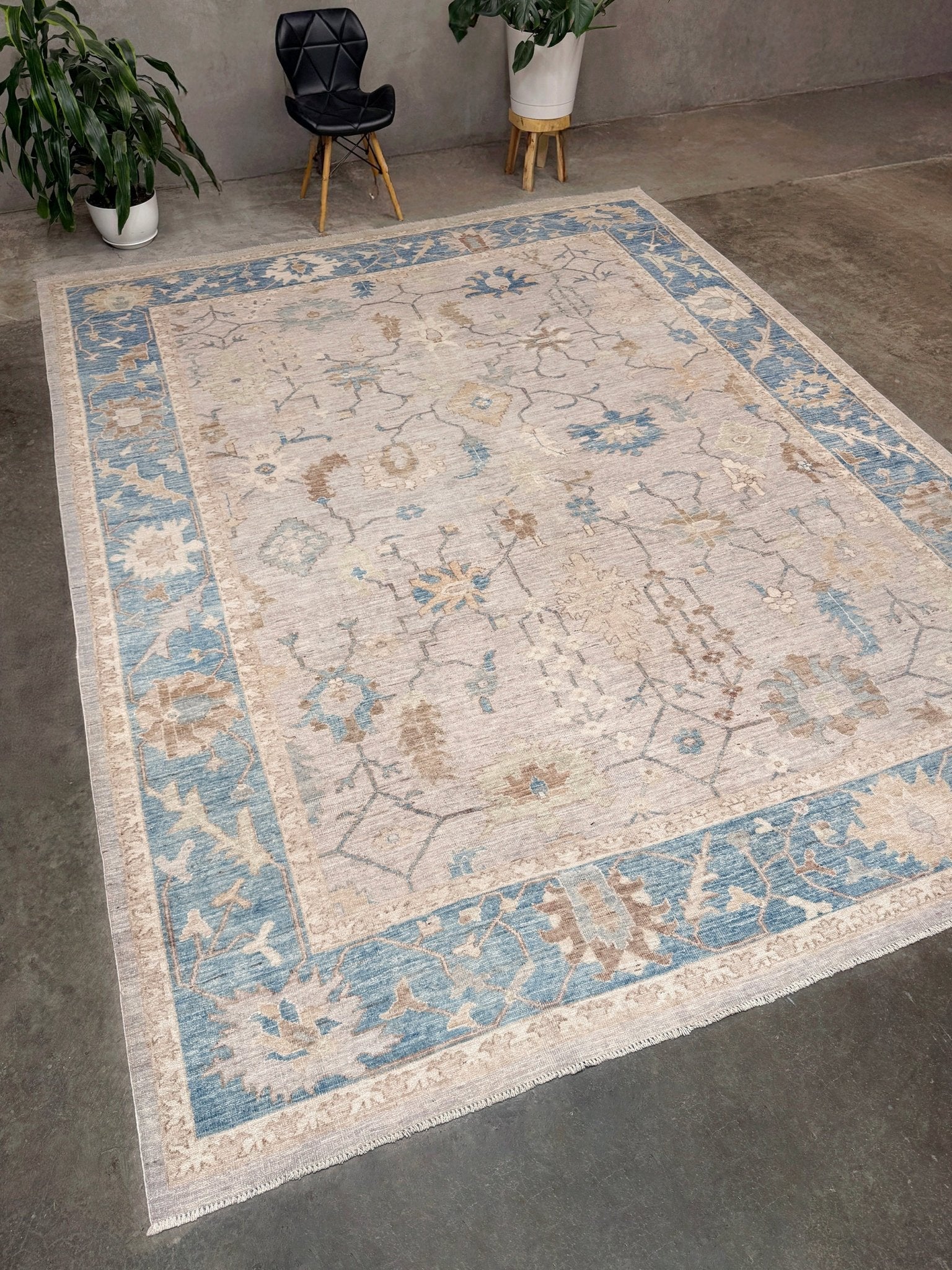Brand new Turkish Oushak rug with soft ivory field, pale blue border, faded floral motifs, handmade wool area rug 9x12 from Indigo Rugs Burlingame Bay Area.