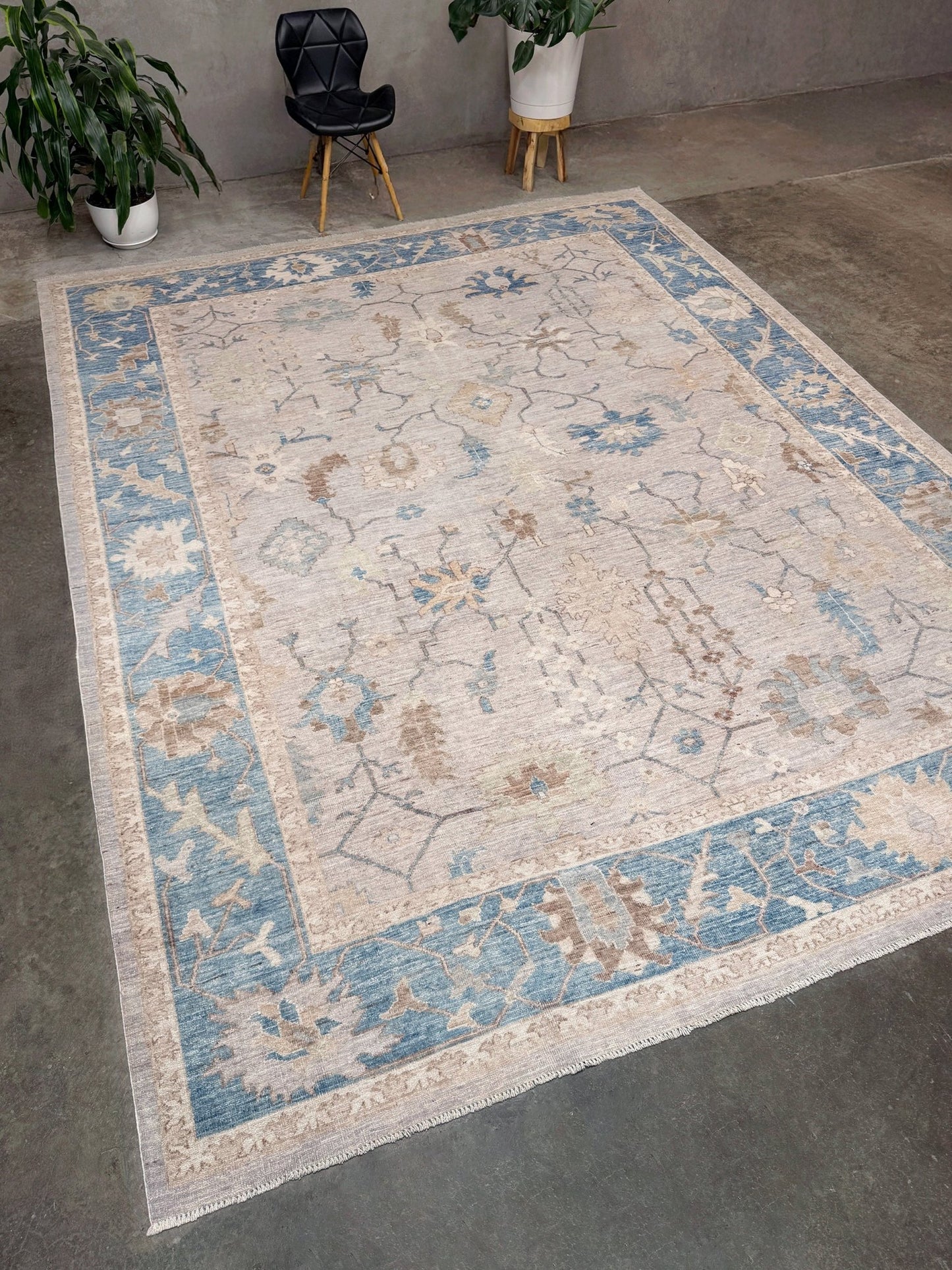 Brand new Turkish Oushak rug with soft ivory field, pale blue border, faded floral motifs, handmade wool area rug 9x12 from Indigo Rugs Burlingame Bay Area.