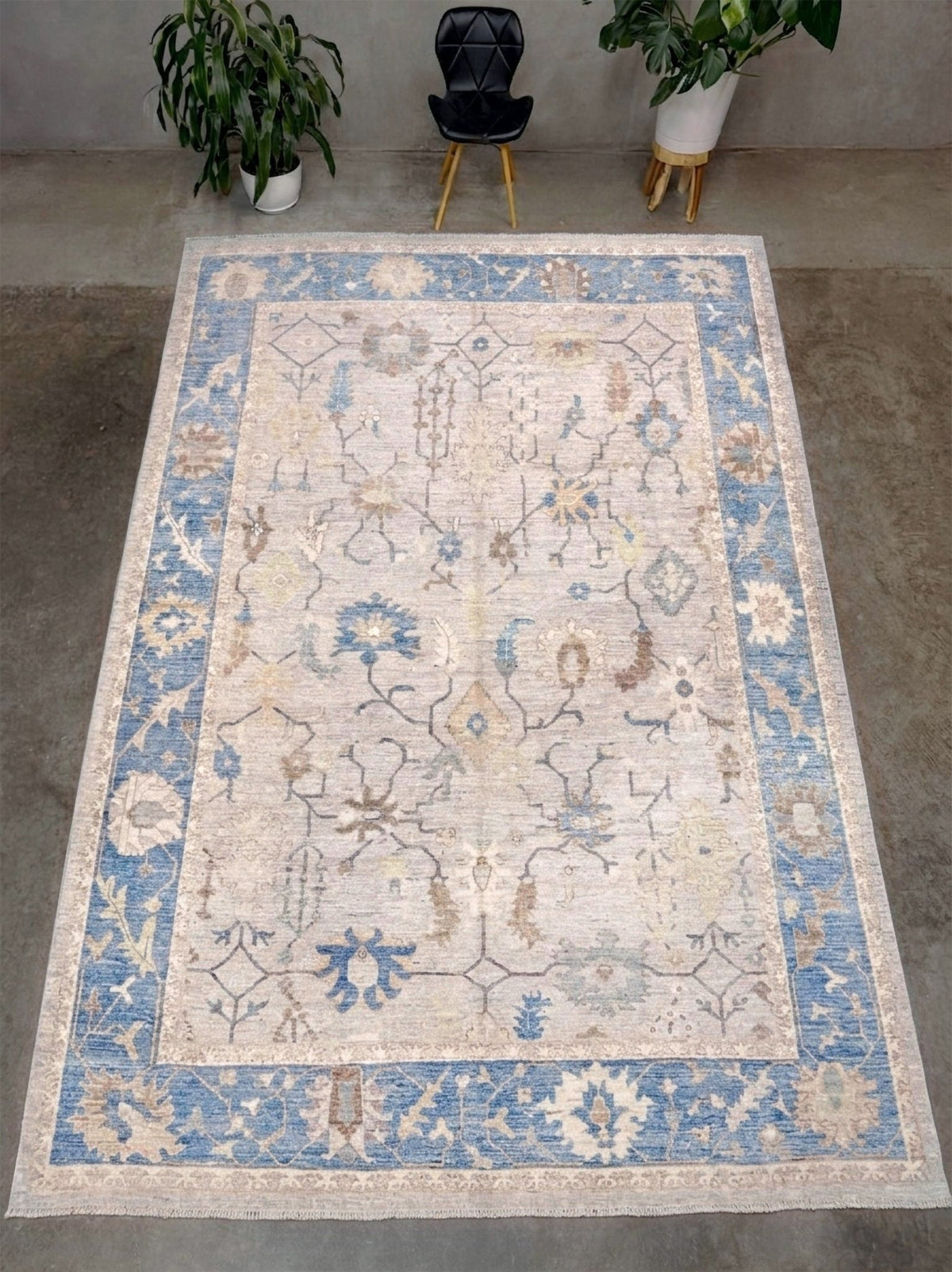 Brand new Turkish Oushak rug with soft ivory field, pale blue border, faded floral motifs, handmade wool area rug 9x12 from Indigo Rugs Burlingame Bay Area.