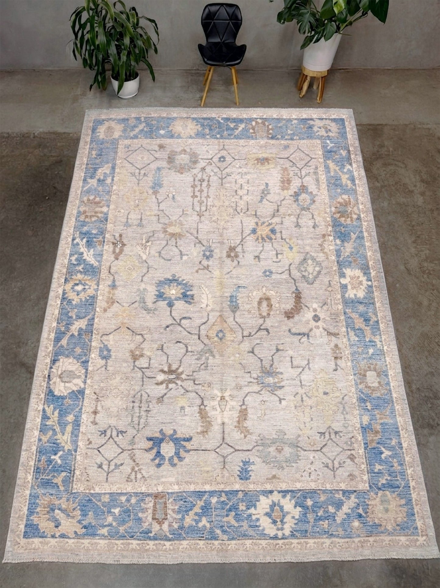 Brand new Turkish Oushak rug with soft ivory field, pale blue border, faded floral motifs, handmade wool area rug 9x12 from Indigo Rugs Burlingame Bay Area.