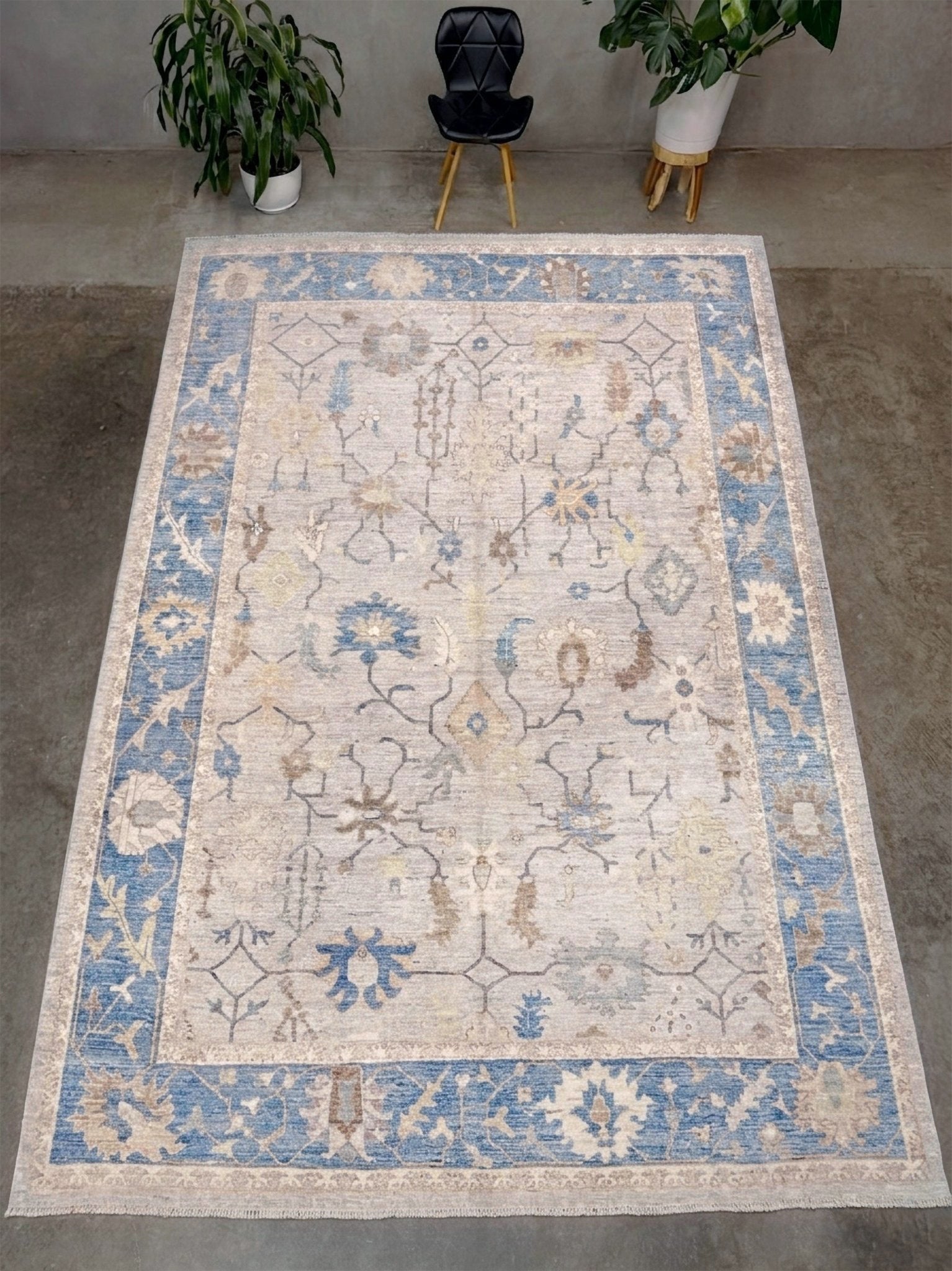 Brand new Turkish Oushak rug with soft ivory field, pale blue border, faded floral motifs, handmade wool area rug 9x12 from Indigo Rugs Burlingame Bay Area.