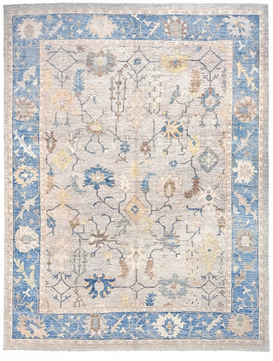 Brand new Turkish Oushak rug with soft ivory field, pale blue border, faded floral motifs, handmade wool area rug 9x12 from Indigo Rugs Burlingame Bay Area.