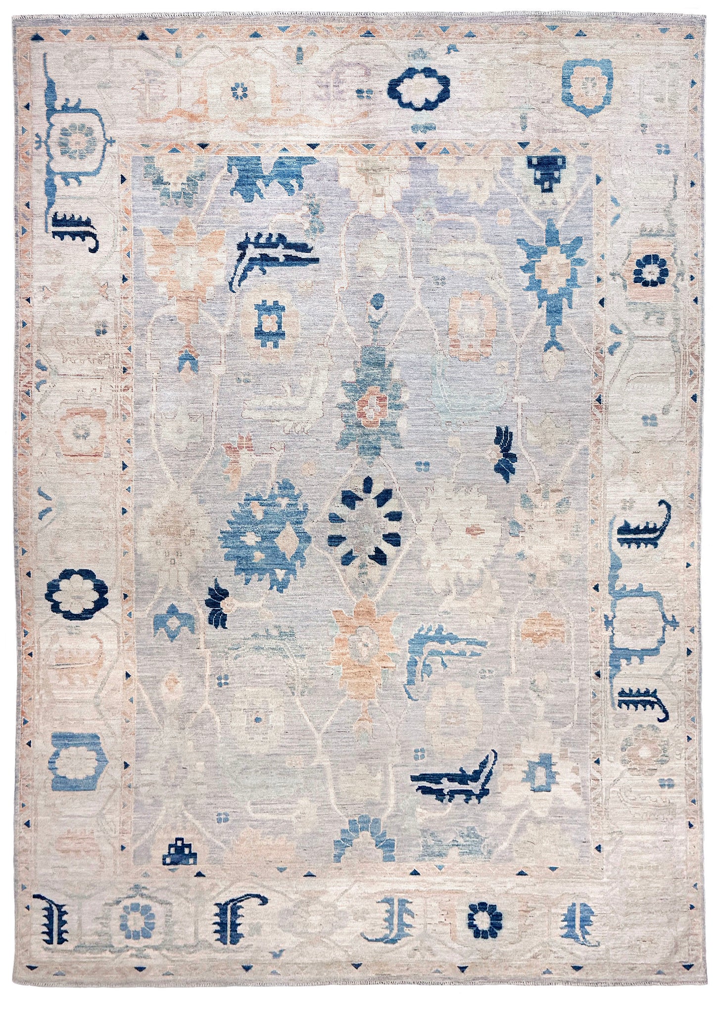 Brand new Turkish Oushak rug with pale blue field, subtle lilac undertones, soft ivory border, faded blue and peach beige accents, handmade wool area rug 9x12 from Indigo Rugs Burlingame Bay Area.