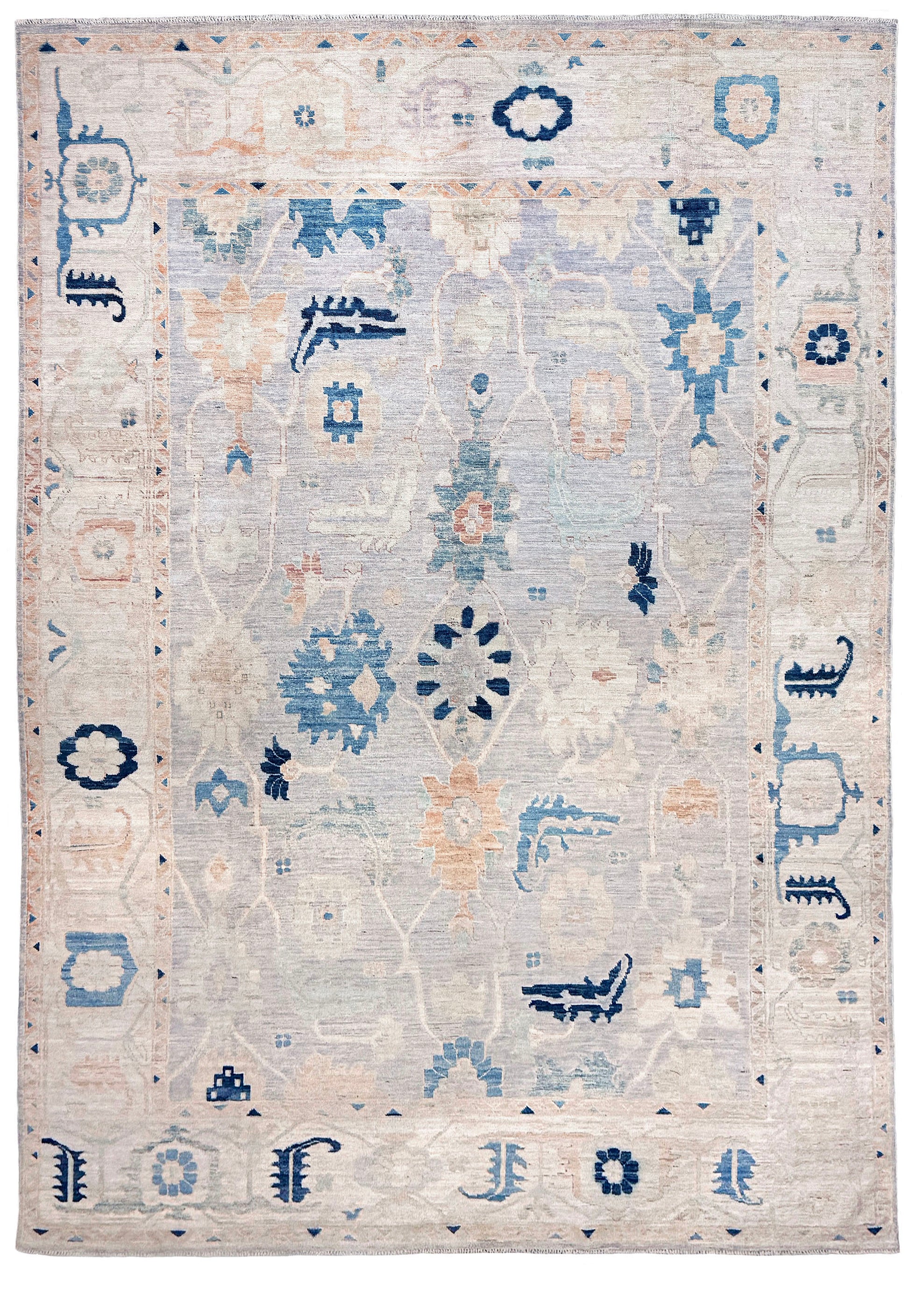 Brand new Turkish Oushak rug with pale blue field, subtle lilac undertones, soft ivory border, faded blue and peach beige accents, handmade wool area rug 9x12 from Indigo Rugs Burlingame Bay Area.