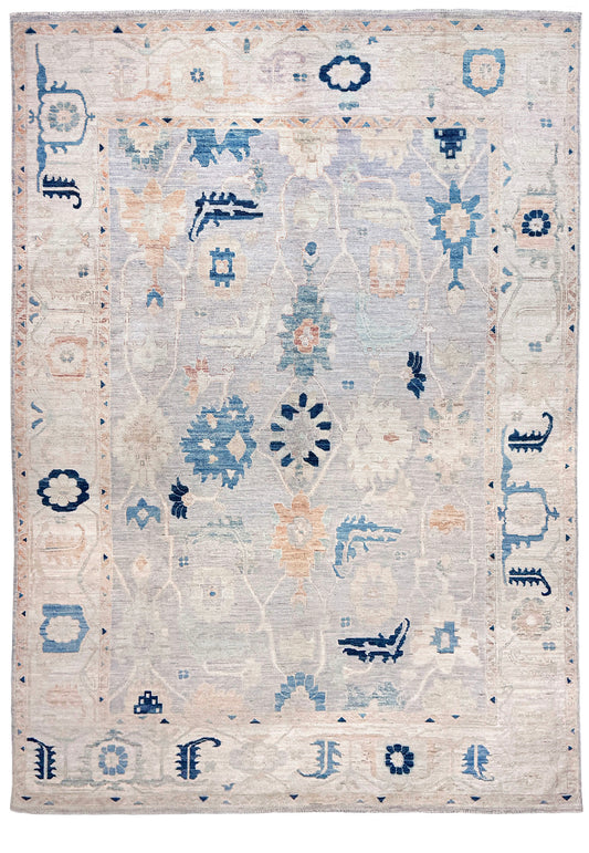 Brand new Turkish Oushak rug with pale blue field, subtle lilac undertones, soft ivory border, faded blue and peach beige accents, handmade wool area rug 9x12 from Indigo Rugs Burlingame Bay Area.
