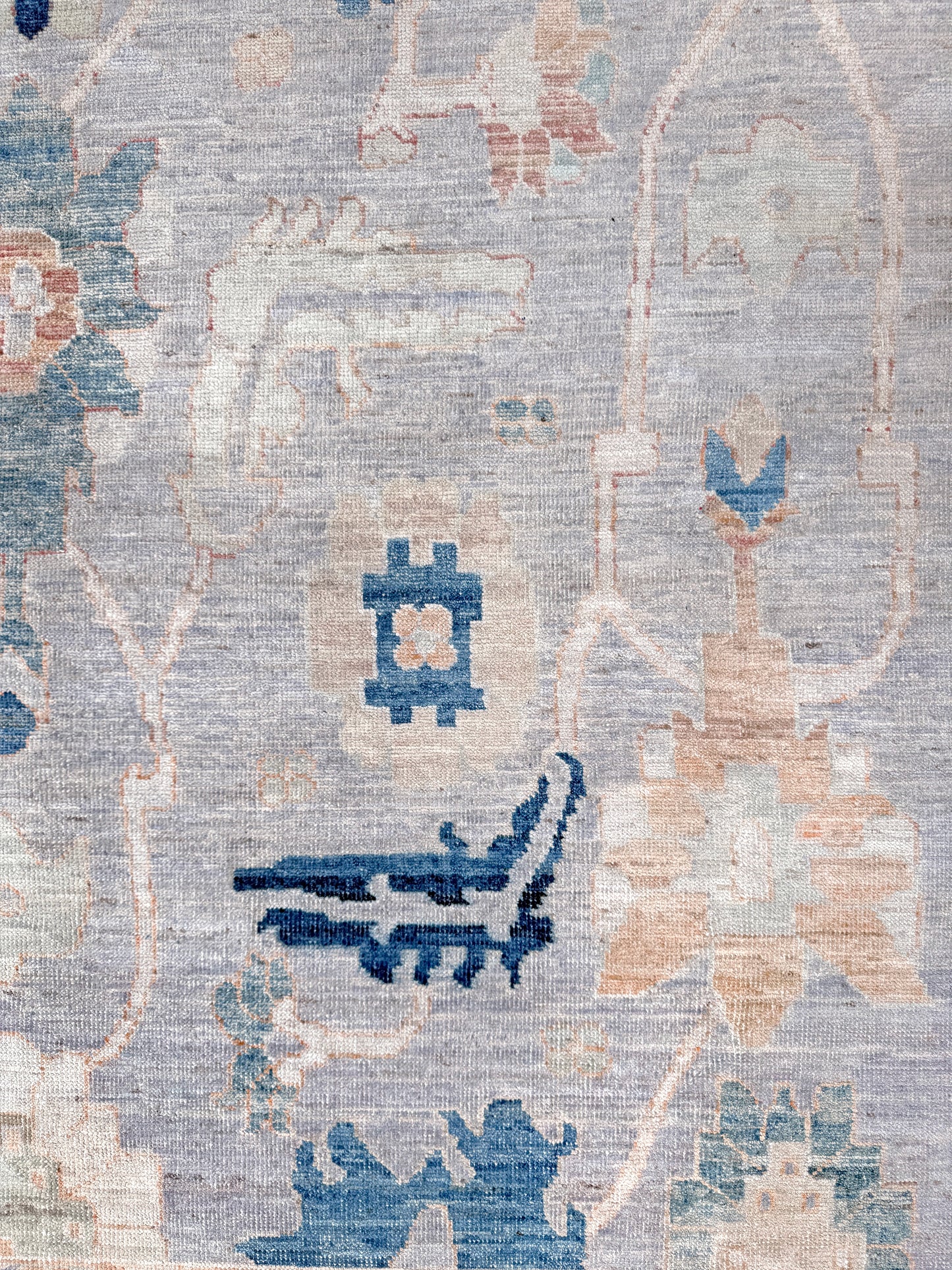Brand new Turkish Oushak rug with pale blue field, subtle lilac undertones, soft ivory border, faded blue and peach beige accents, handmade wool area rug 9x12 from Indigo Rugs Burlingame Bay Area.