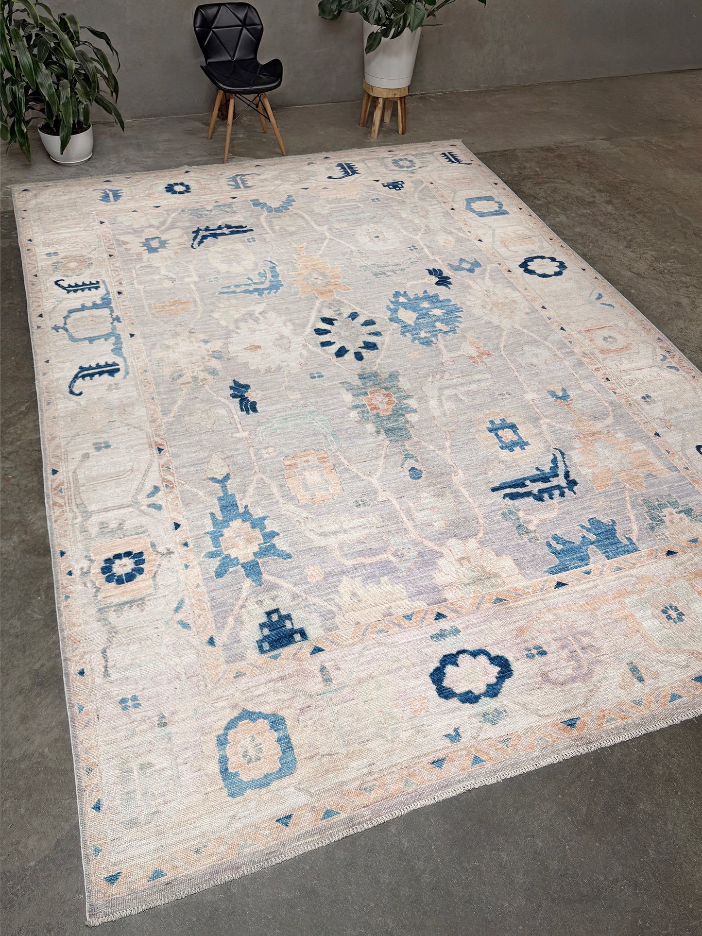 Brand new Turkish Oushak rug with pale blue field, subtle lilac undertones, soft ivory border, faded blue and peach beige accents, handmade wool area rug 9x12 from Indigo Rugs Burlingame Bay Area.