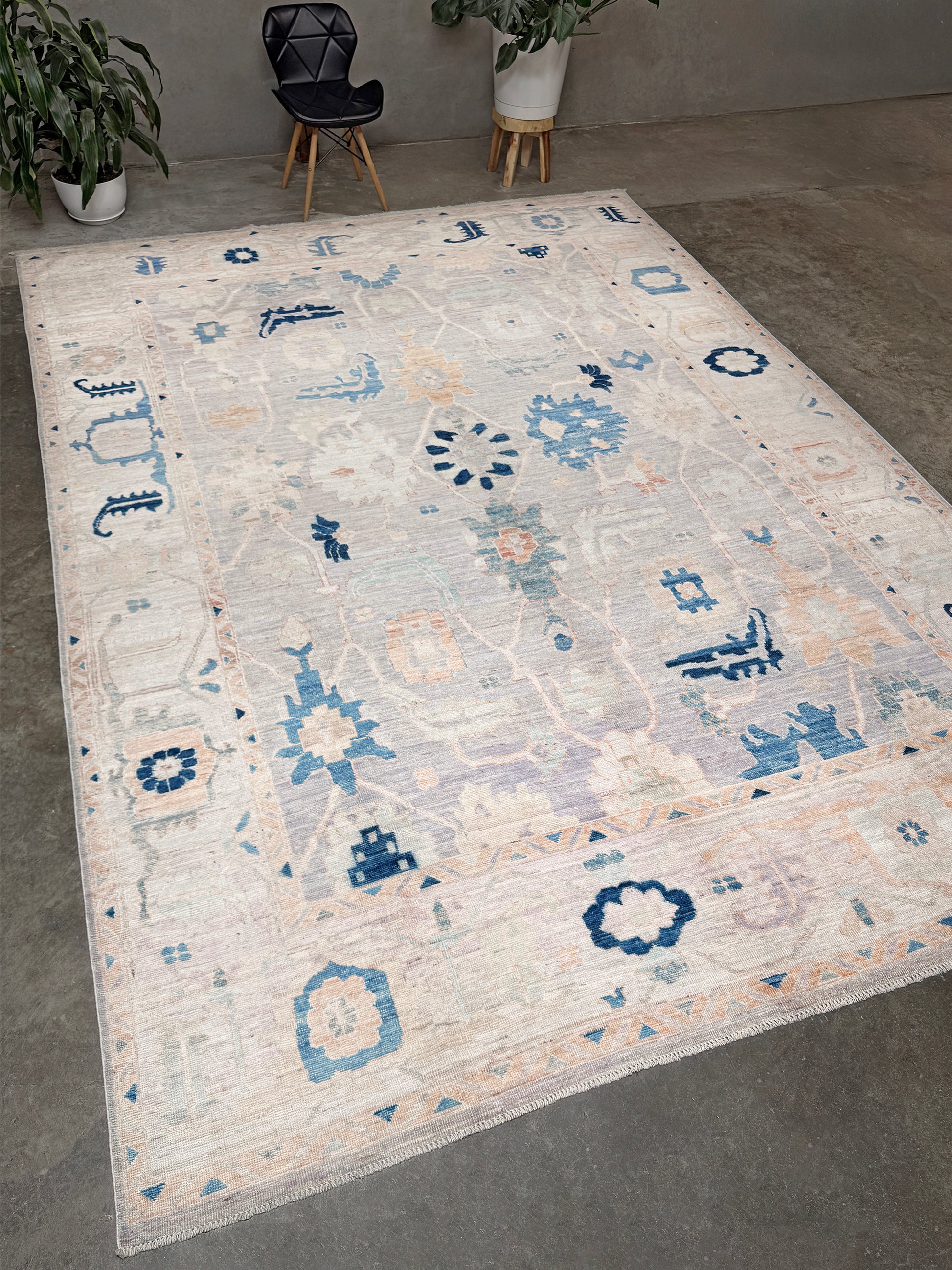 Brand new Turkish Oushak rug with pale blue field, subtle lilac undertones, soft ivory border, faded blue and peach beige accents, handmade wool area rug 9x12 from Indigo Rugs Burlingame Bay Area.