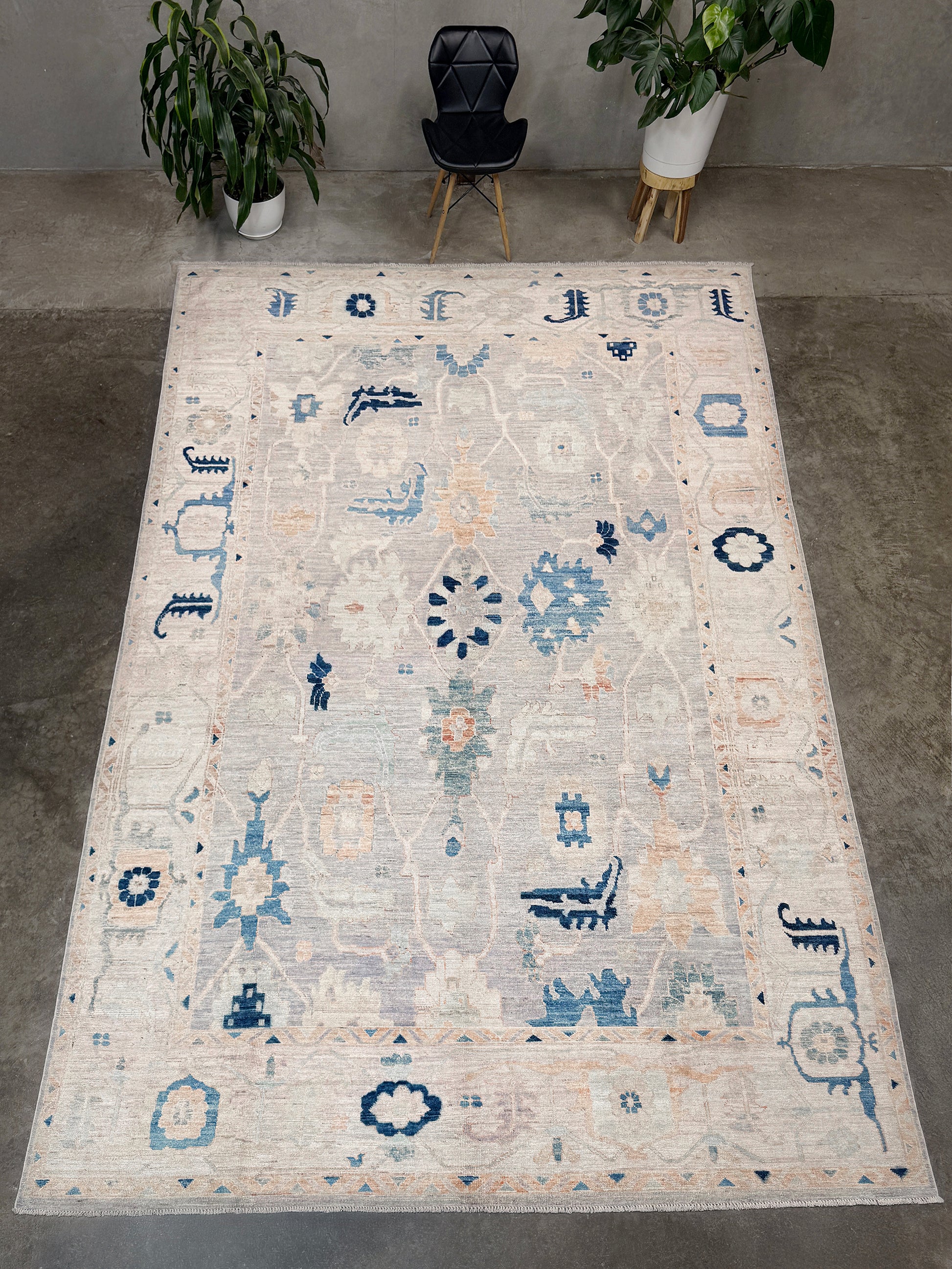Brand new Turkish Oushak rug with pale blue field, subtle lilac undertones, soft ivory border, faded blue and peach beige accents, handmade wool area rug 9x12 from Indigo Rugs Burlingame Bay Area.