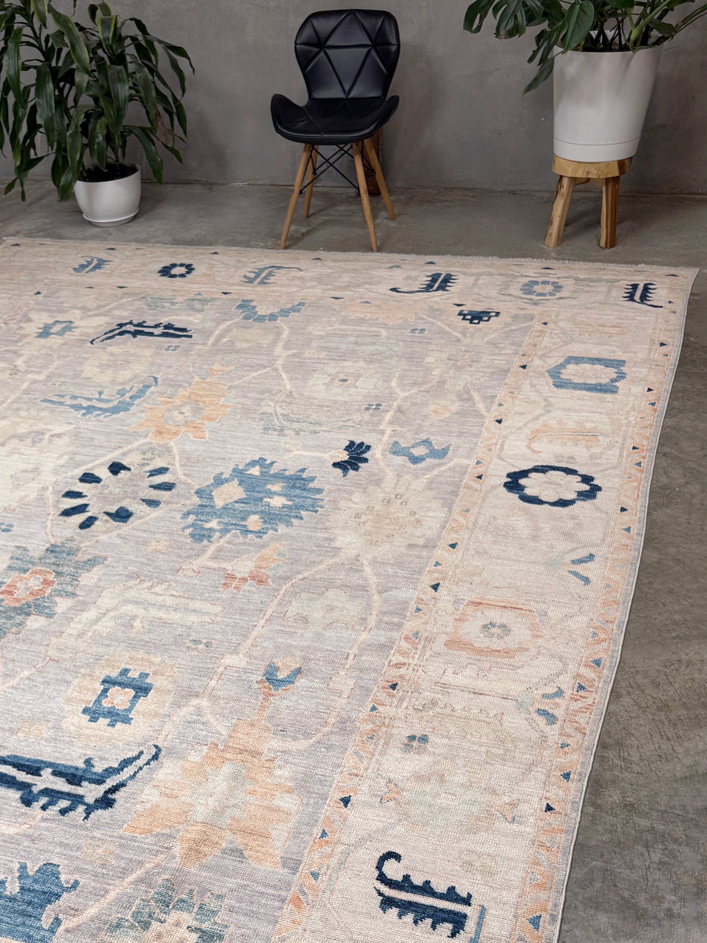 Brand new Turkish Oushak rug with pale blue field, subtle lilac undertones, soft ivory border, faded blue and peach beige accents, handmade wool area rug 9x12 from Indigo Rugs Burlingame Bay Area.