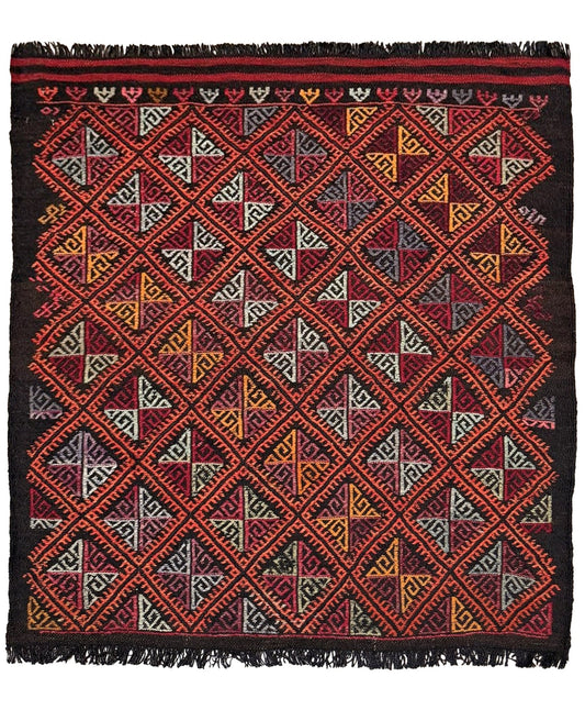 Woven textile with geometric pattern on a plain background