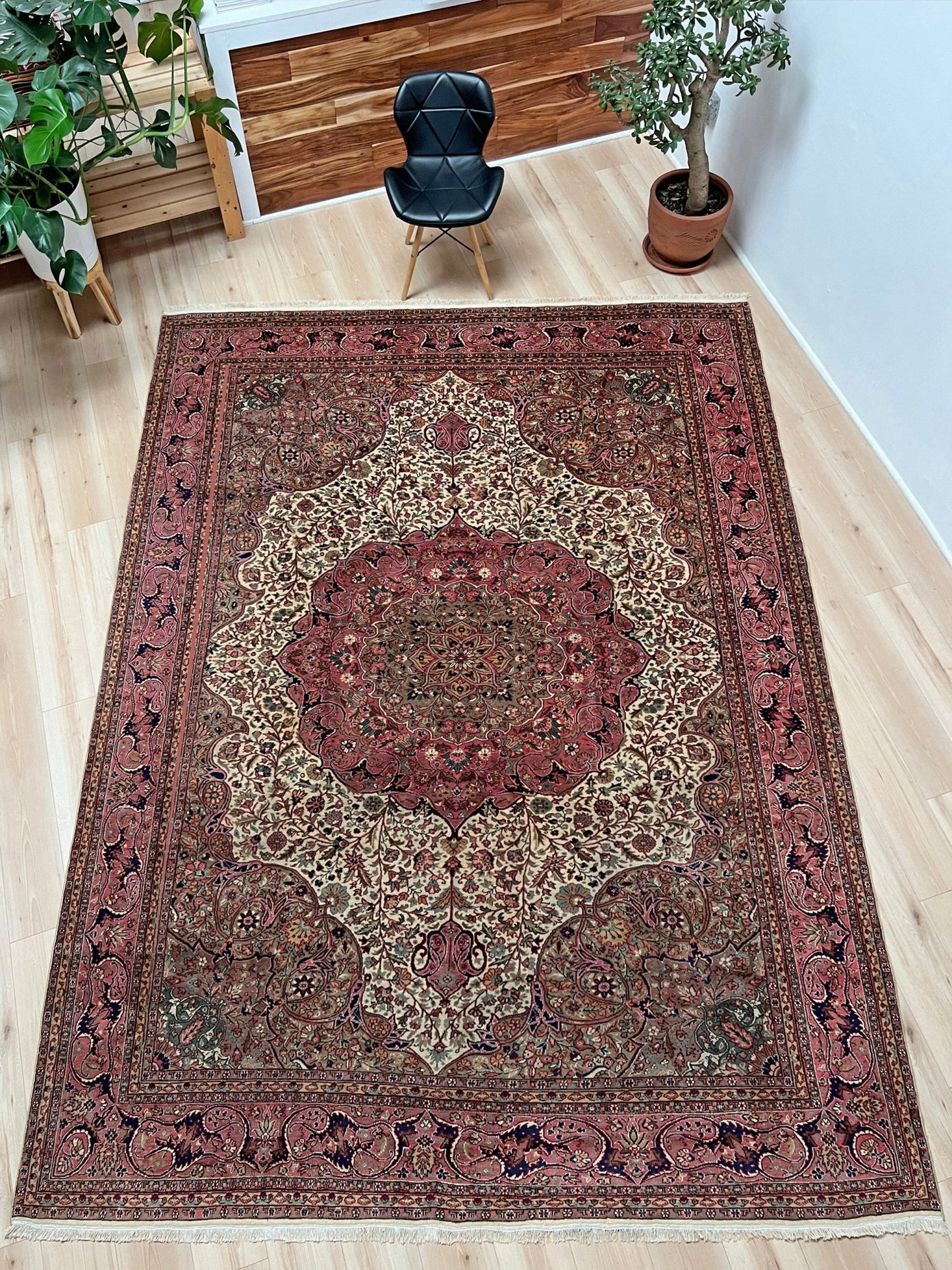 Pink and brown vintage Kayseri Turkish rug in a living room setting , a luxurious 9x12 handmade wool carpet with an intricate floral pattern, available in the San Francisco Bay Area rug shop with free shipping. Perfect for enhancing the elegance of living rooms, bedrooms, dining areas, or offices with its unique handcrafted design.