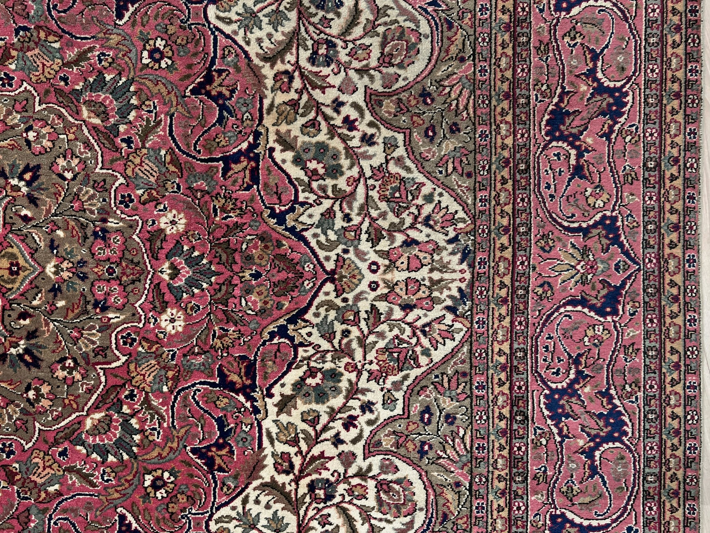 Close-up detail of a pink and brown vintage Kayseri Turkish rug, highlighting the intricate floral patterns and fine craftsmanship. This luxurious 9x12 handmade wool carpet is available in the San Francisco Bay Area with free shipping, perfect for adding a touch of elegance to any home decor.