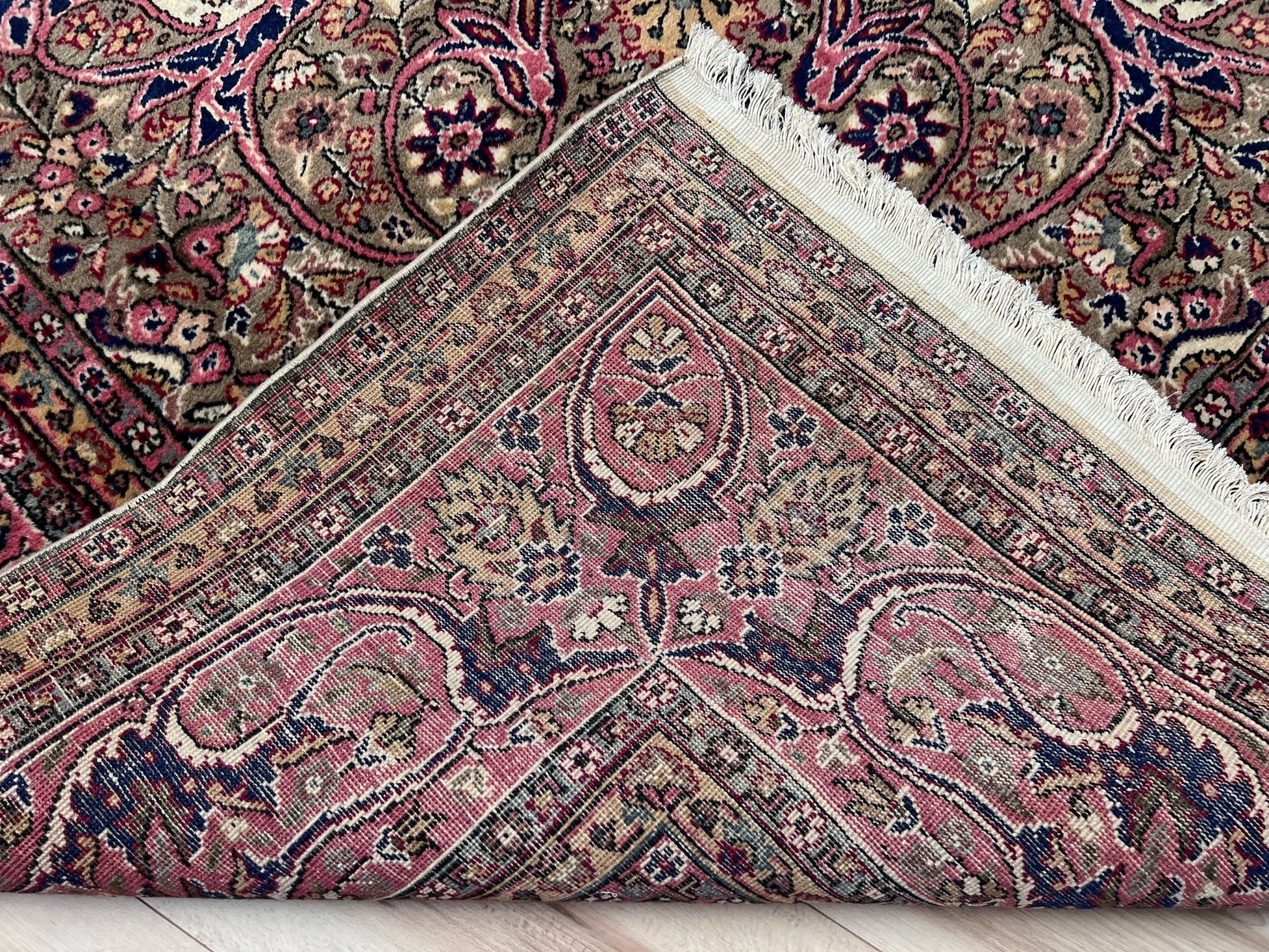 Back of  a pink and brown vintage Kayseri Turkish rug, highlighting the intricate floral patterns and fine craftsmanship. This luxurious 9x12 handmade wool carpet is available in the San Francisco Bay Area with free shipping, perfect for adding a touch of elegance to any home decor.