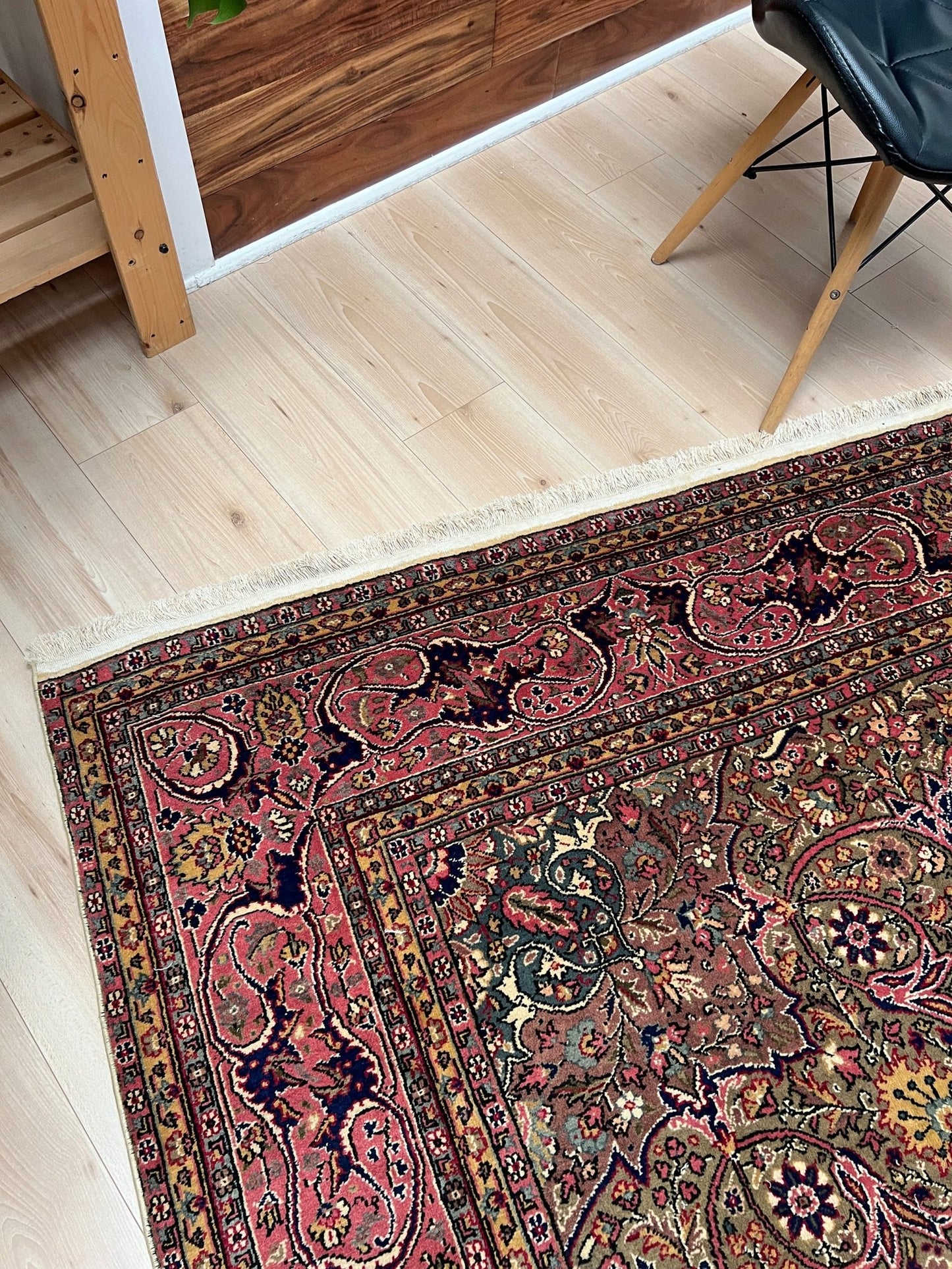 Corner detail of a pink and brown vintage Kayseri Turkish rug, highlighting the intricate floral patterns and fine craftsmanship. This luxurious 9x12 handmade wool carpet is available in the San Francisco Bay Area with free shipping, perfect for adding a touch of elegance to any home decor.