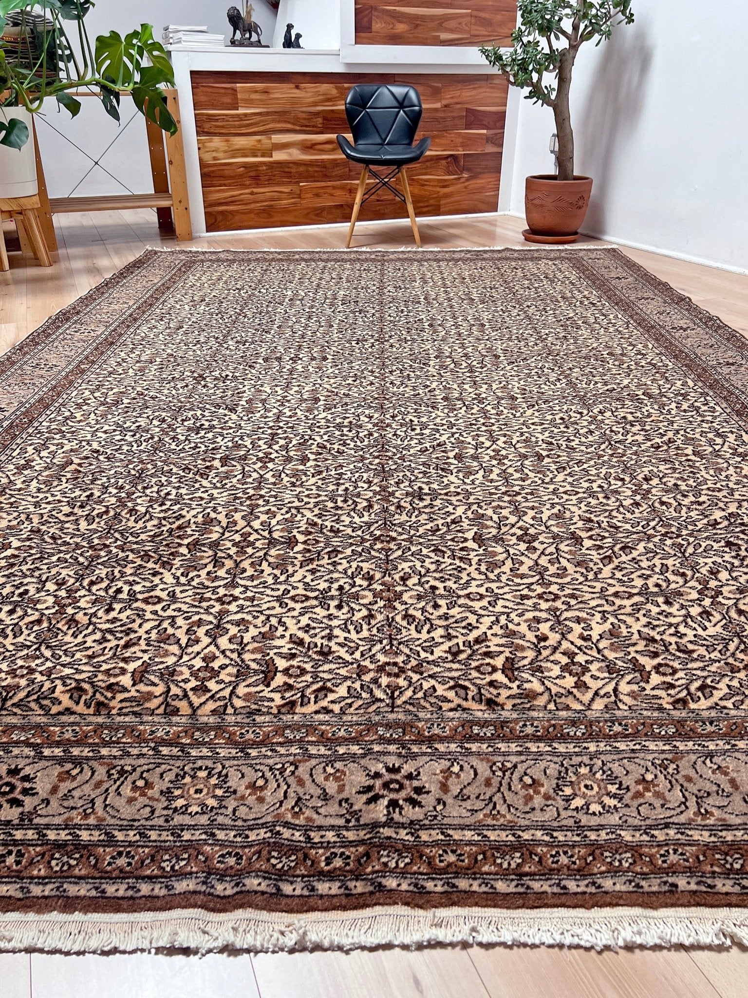 Close-up picture of Neutral Kayseri Turkish Rug in a modern living room setting, showcasing an 8x12 handmade wool carpet with a floral pattern, made from undyed wool. Ideal for adding elegance to a living room, bedroom, dining room, or office decor. Free shipping from our rug shop in San Francisco Bay Area to USA and Canada.