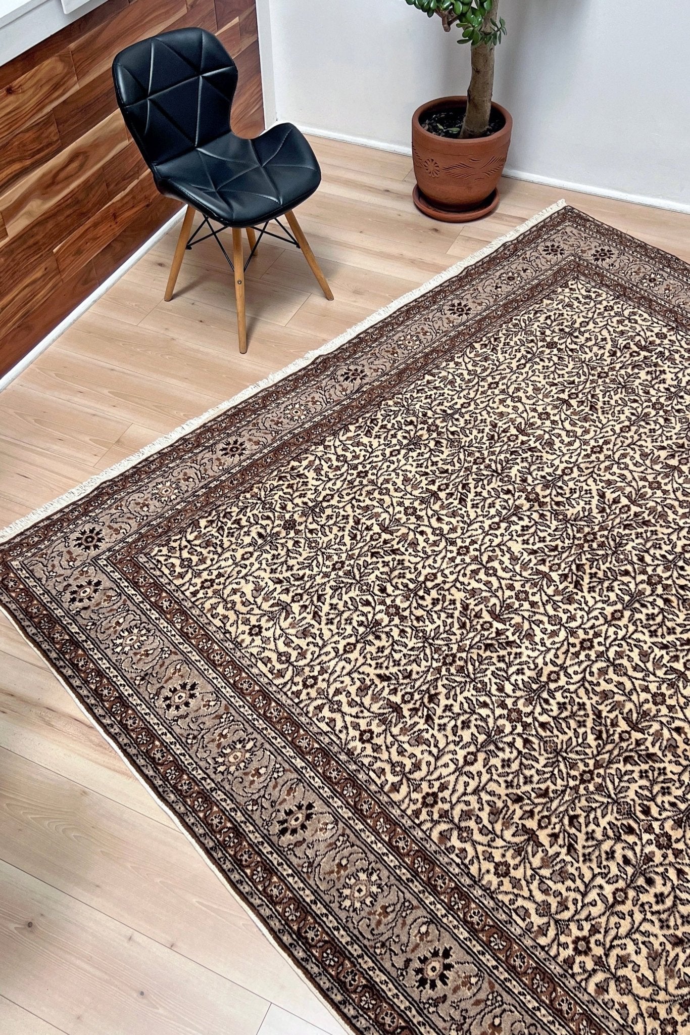 Side angled picture of Neutral Kayseri Turkish Rug in a modern living room setting, showcasing an 8x12 handmade wool carpet with a floral pattern, made from undyed wool. Ideal for adding elegance to a living room, bedroom, dining room, or office decor. Free shipping from our rug shop in San Francisco Bay Area to USA and Canada.