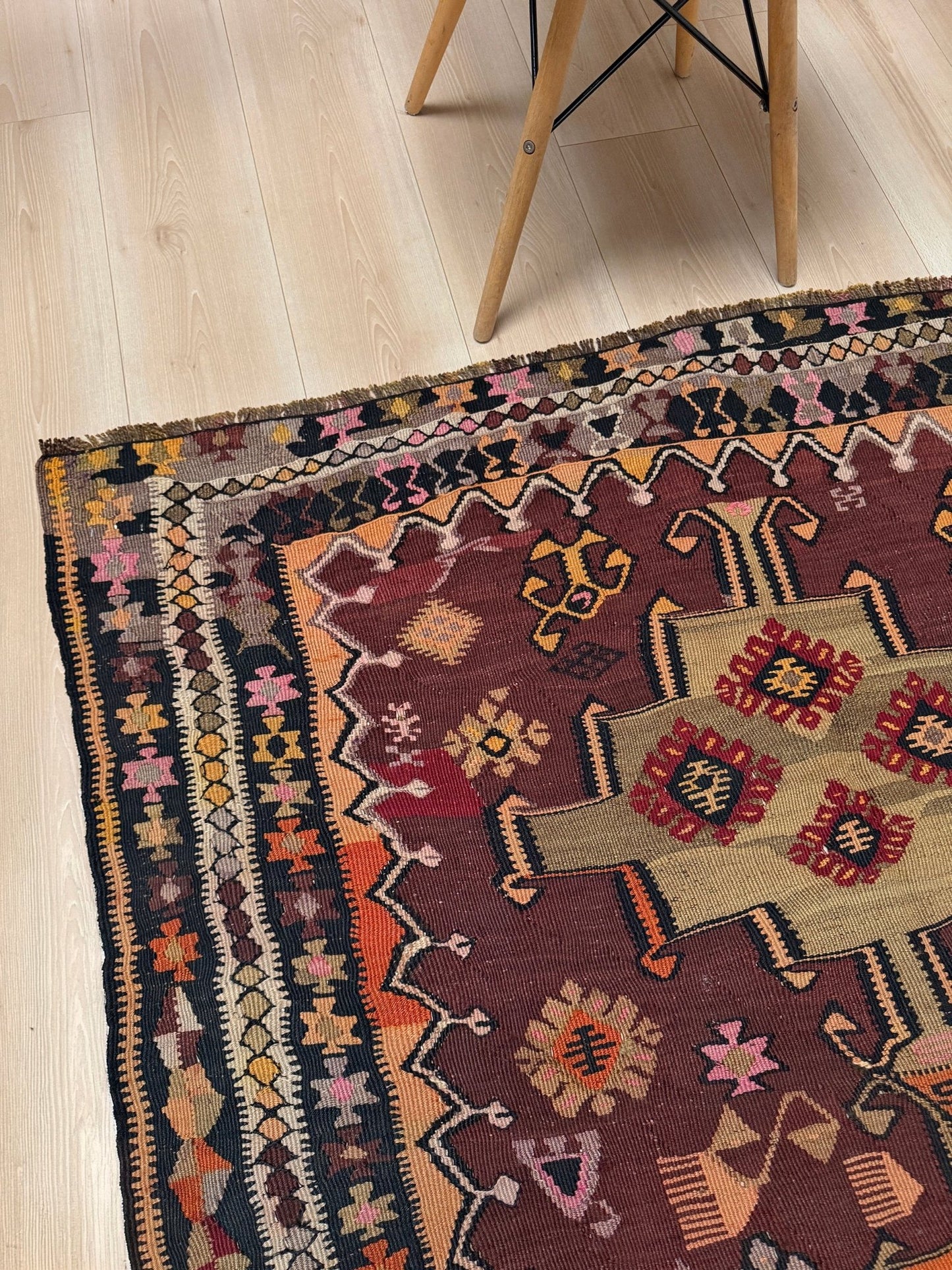 Vintage Kurdish Kars kilim, featuring maroon red and chestnut brown field, geometric medallions, symbolic tribal motifs and protective symbols, handwoven wool 5x10 flatweave rug 